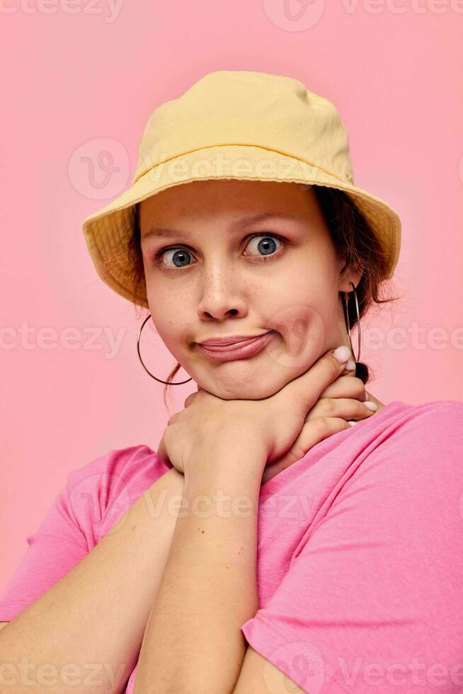 portrait of a young woman Youth clothing posing modern style pink background photo