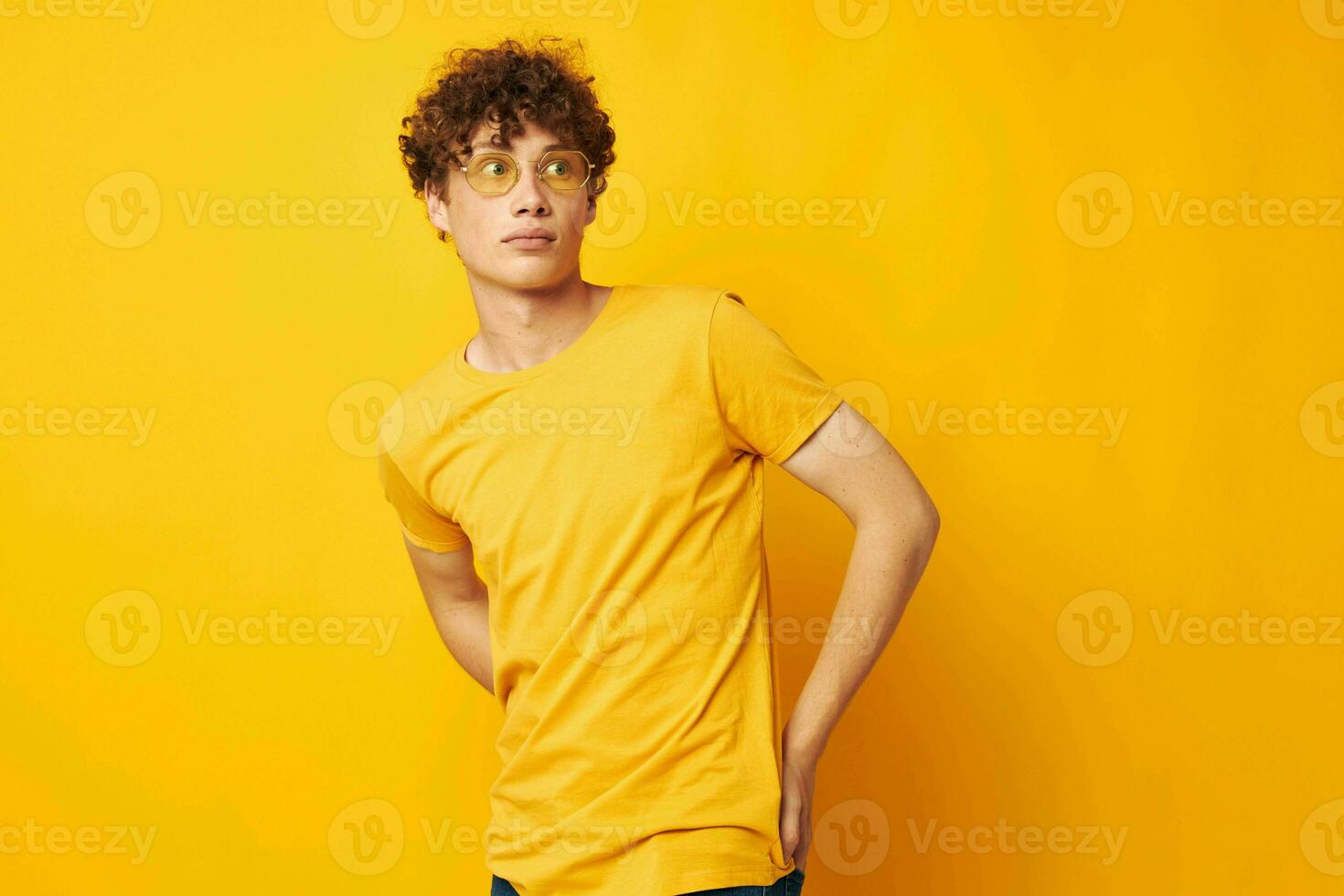 portrait of a young curly man Youth style glasses studio casual wear monochrome shot photo