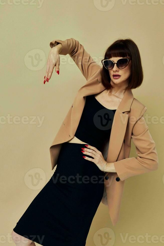 beautiful woman in a beige jacket elegant style sunglasses Lifestyle unaltered photo