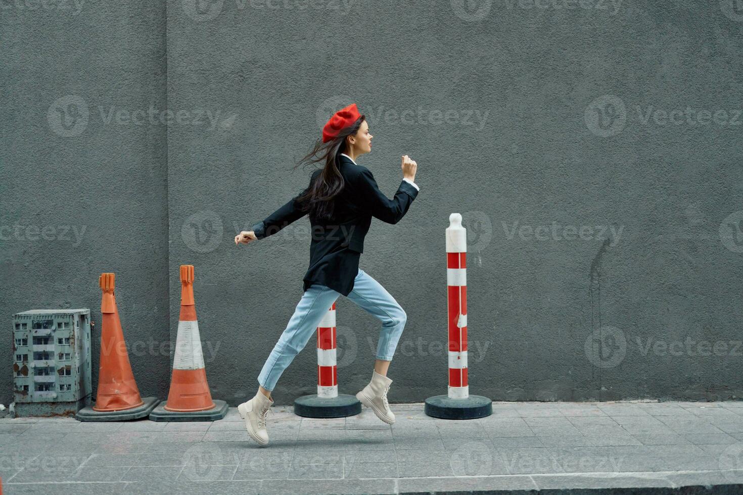 Fashion woman running down the street in front of the city tourist in stylish clothes with red lips and red beret, travel, cinematic color, retro vintage style. photo