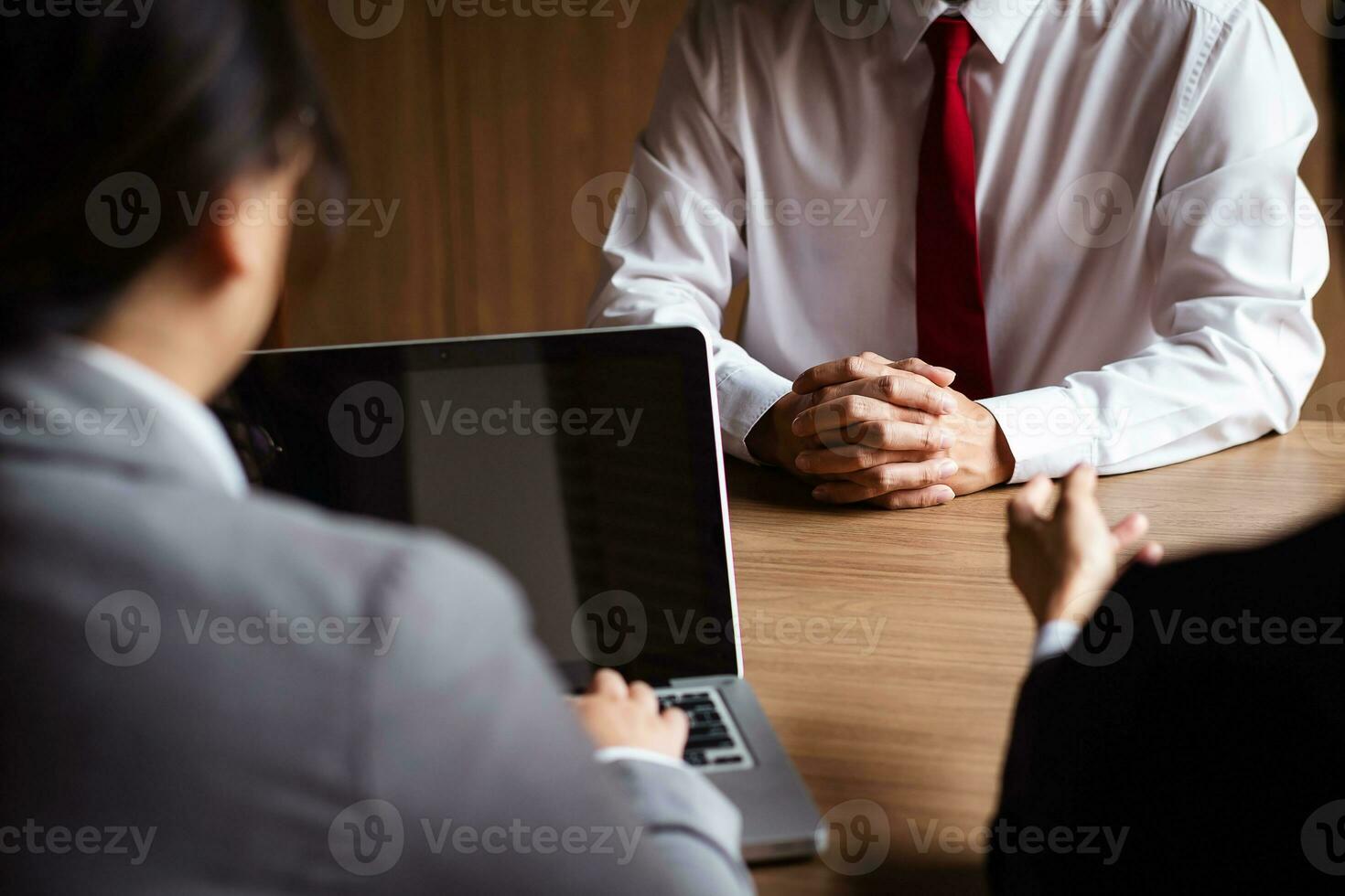 Image of employer or recruiter holding reading a resume during about colloquy his profile of candidate. photo