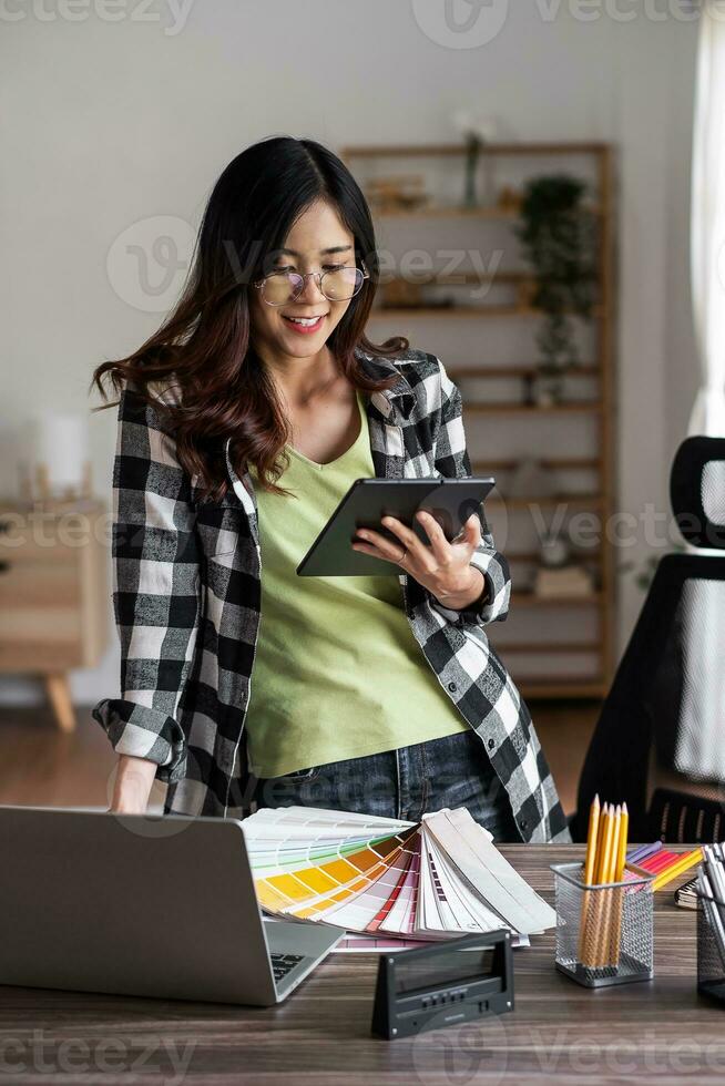 Verticla image of graphic designer working with tablet for creativity editor ideas designer concept. photo