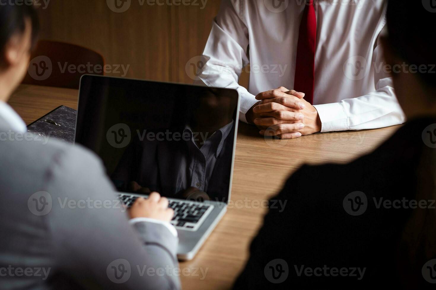 Image of employer or recruiter holding reading a resume during about colloquy his profile of candidate. photo