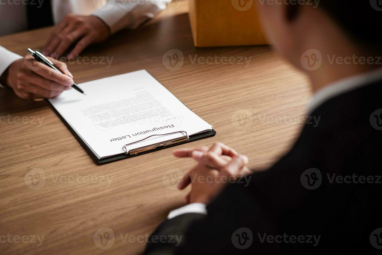 Image of employer or recruiter holding reading a resume during about colloquy his profile of candidate. photo