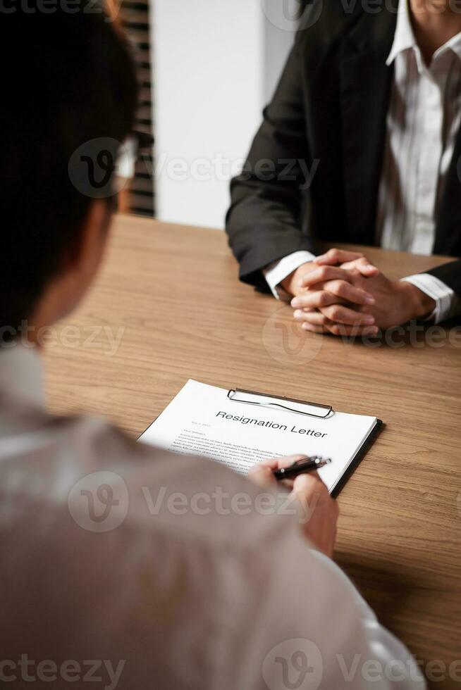 Image of employer or recruiter holding reading a resume during about colloquy his profile of candidate. photo