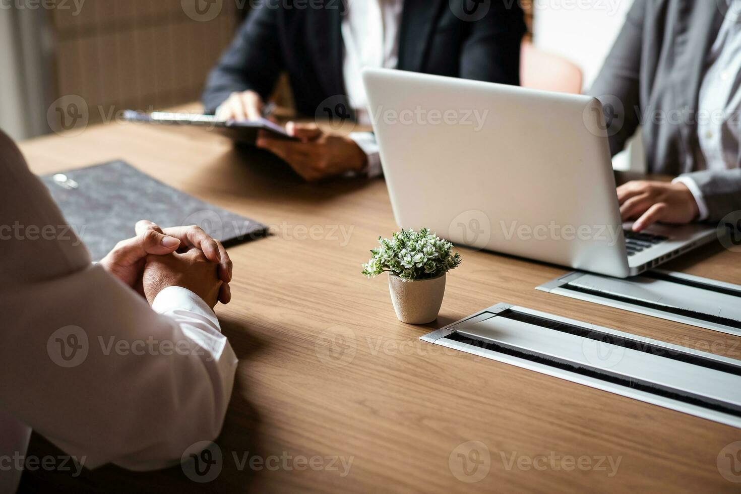 Image of employer or recruiter holding reading a resume during about colloquy his profile of candidate. photo