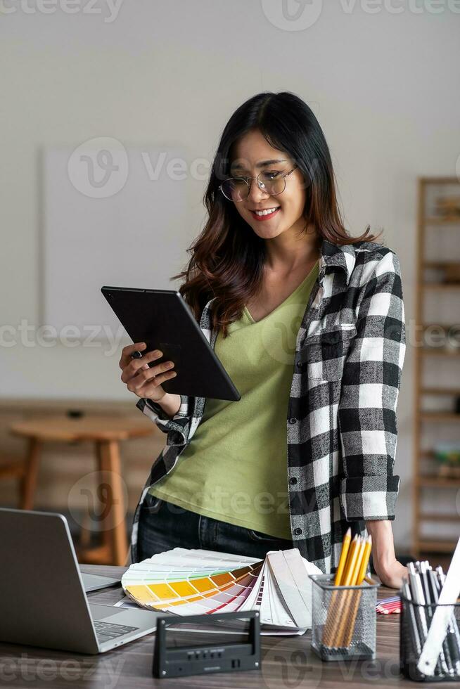 Verticla image of graphic designer working with tablet for creativity editor ideas designer concept. photo