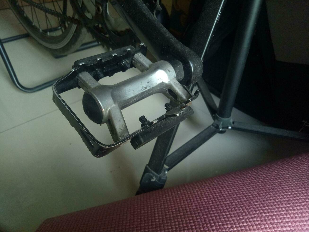 Photo of a bicycle pedal crank made of aluminum in black color