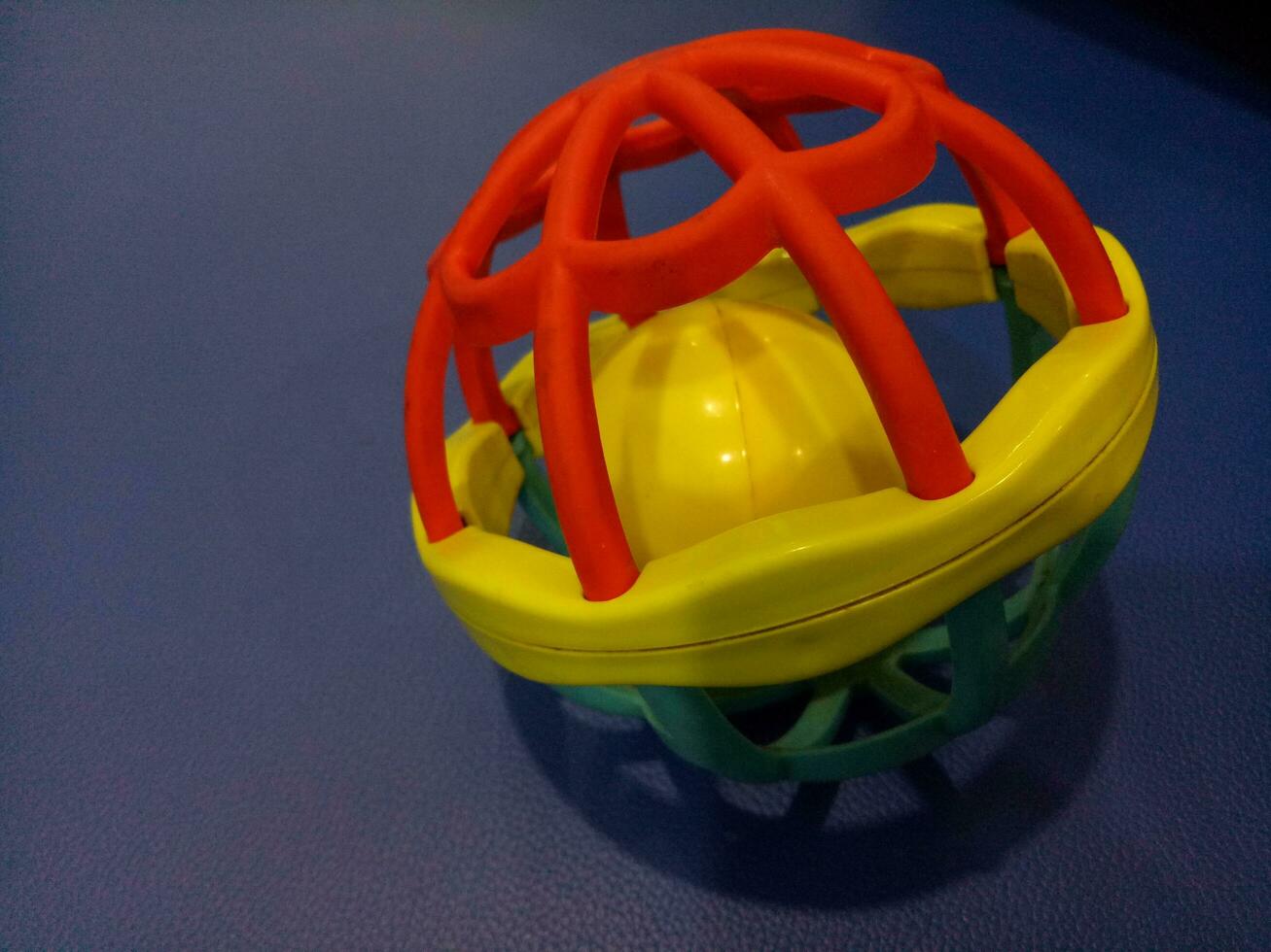 Ball toy with colorful plastic spokes with a loud sound for babies photo