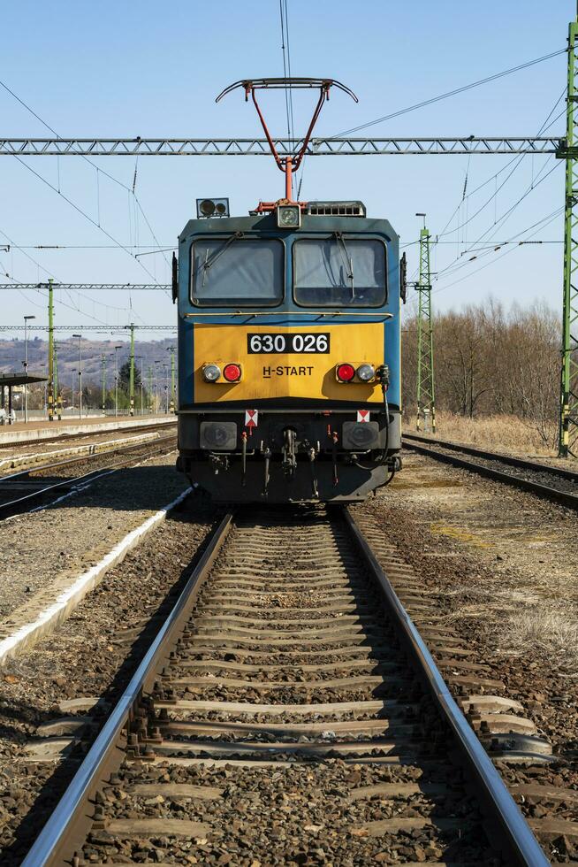 Locomotive train at railway station. International transportation. Global freight. Cargo transport. Railways industry. photo