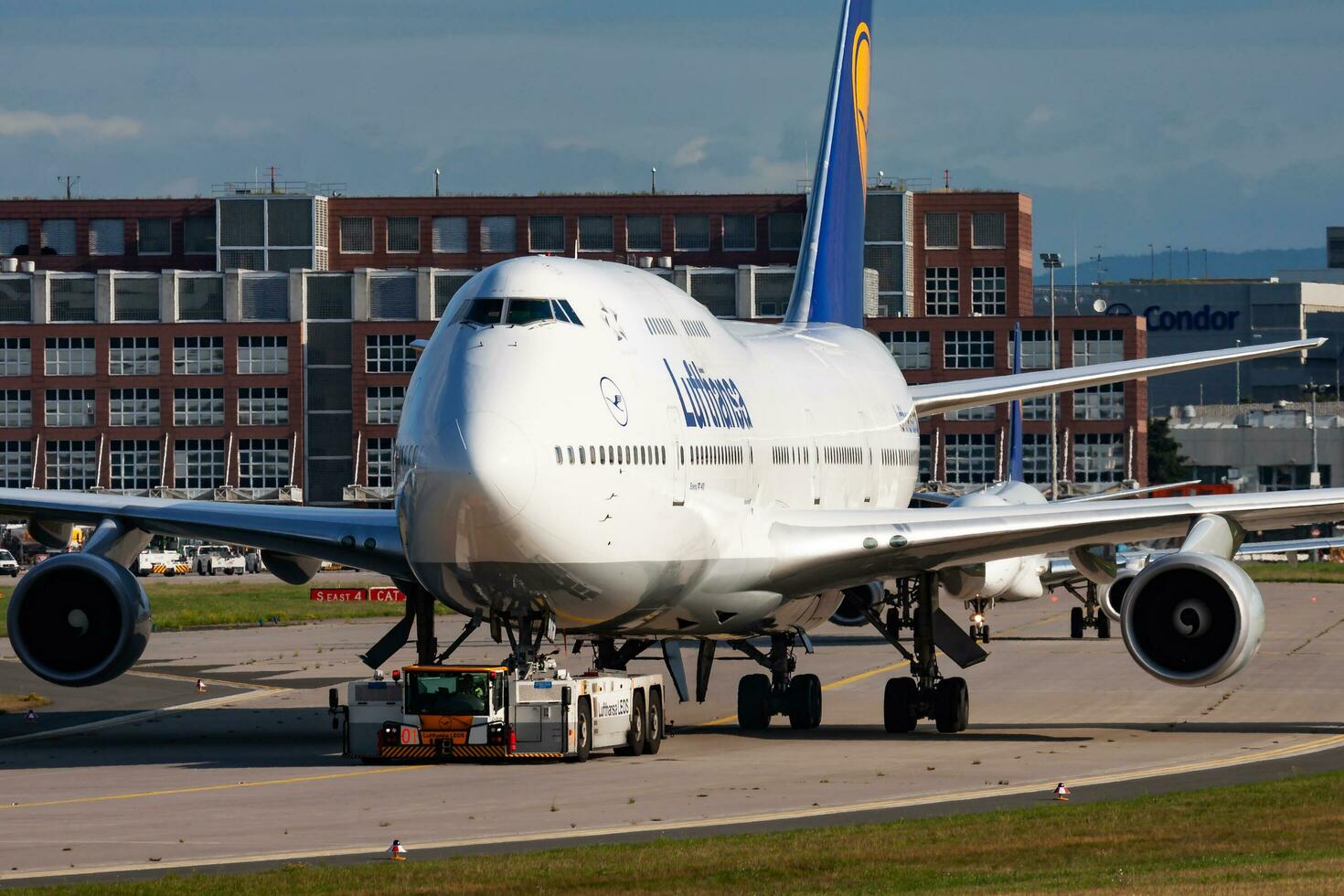 Lufthansa passenger plane at airport. Schedule flight travel. Aviation and aircraft. Air transport. Global international transportation. Fly and flying. photo