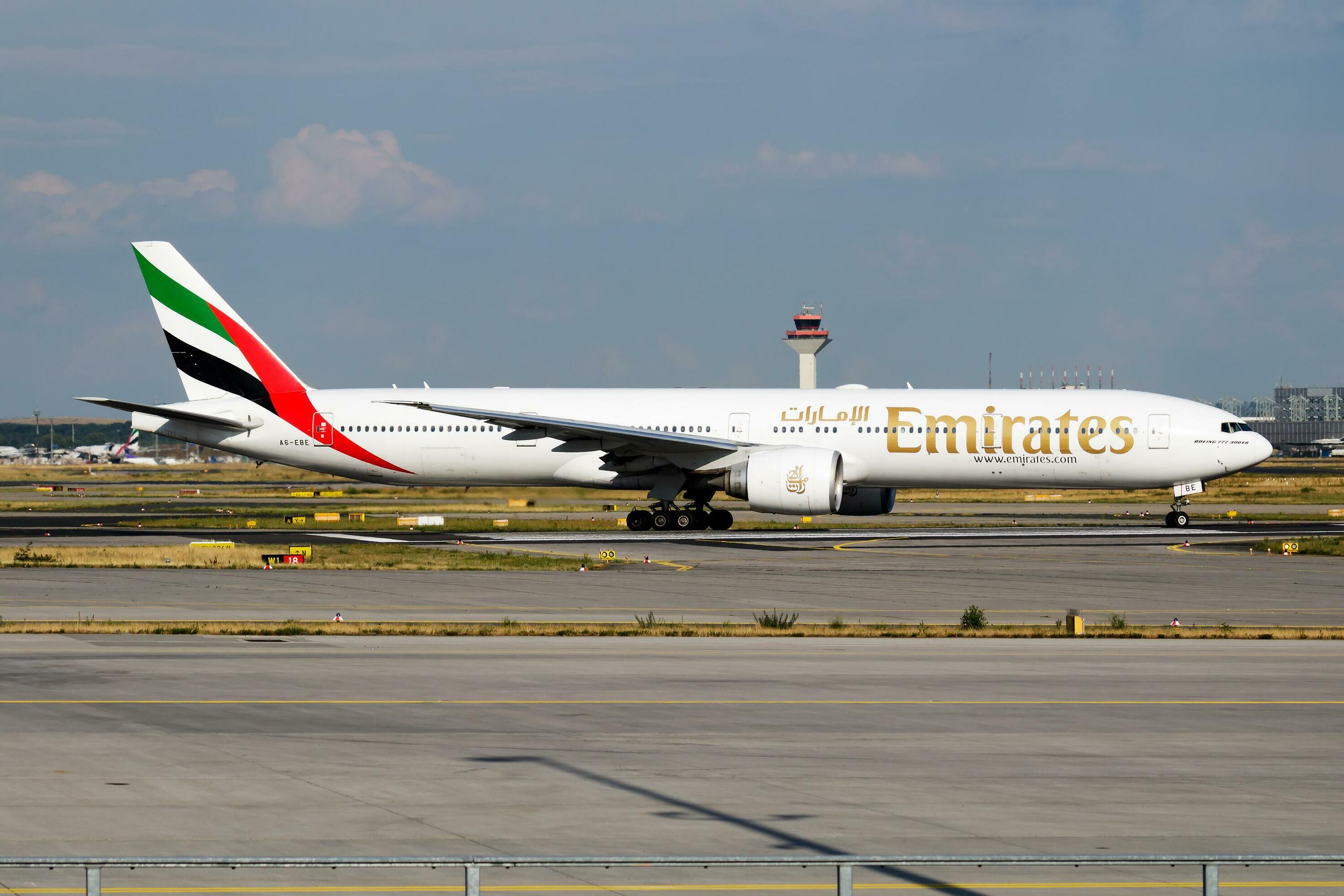 Emirates Airlines passenger plane at airport. Schedule flight travel
