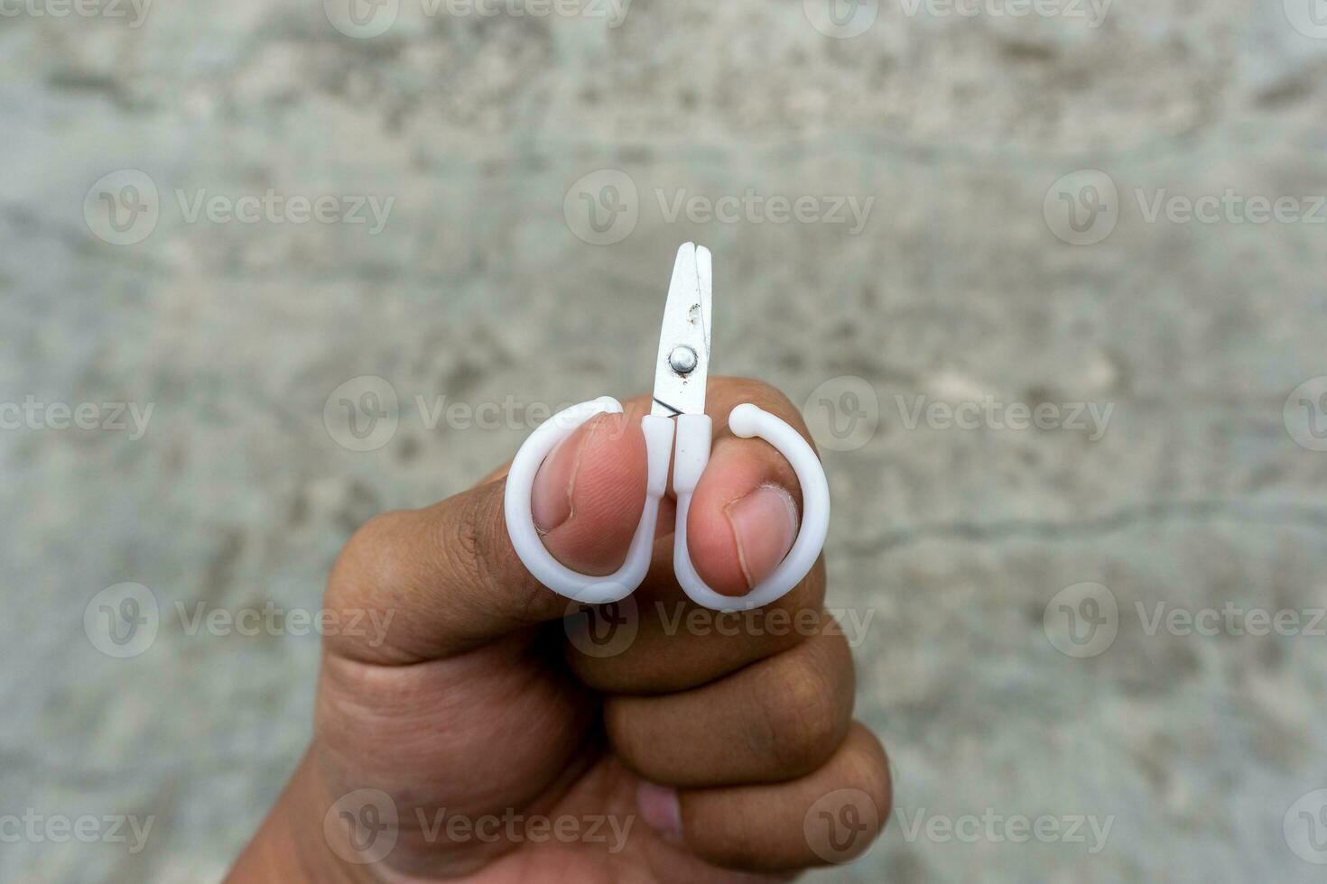 cute little scissors for kids playing. Small scissors on adult hand.  25739916 Stock Photo at Vecteezy