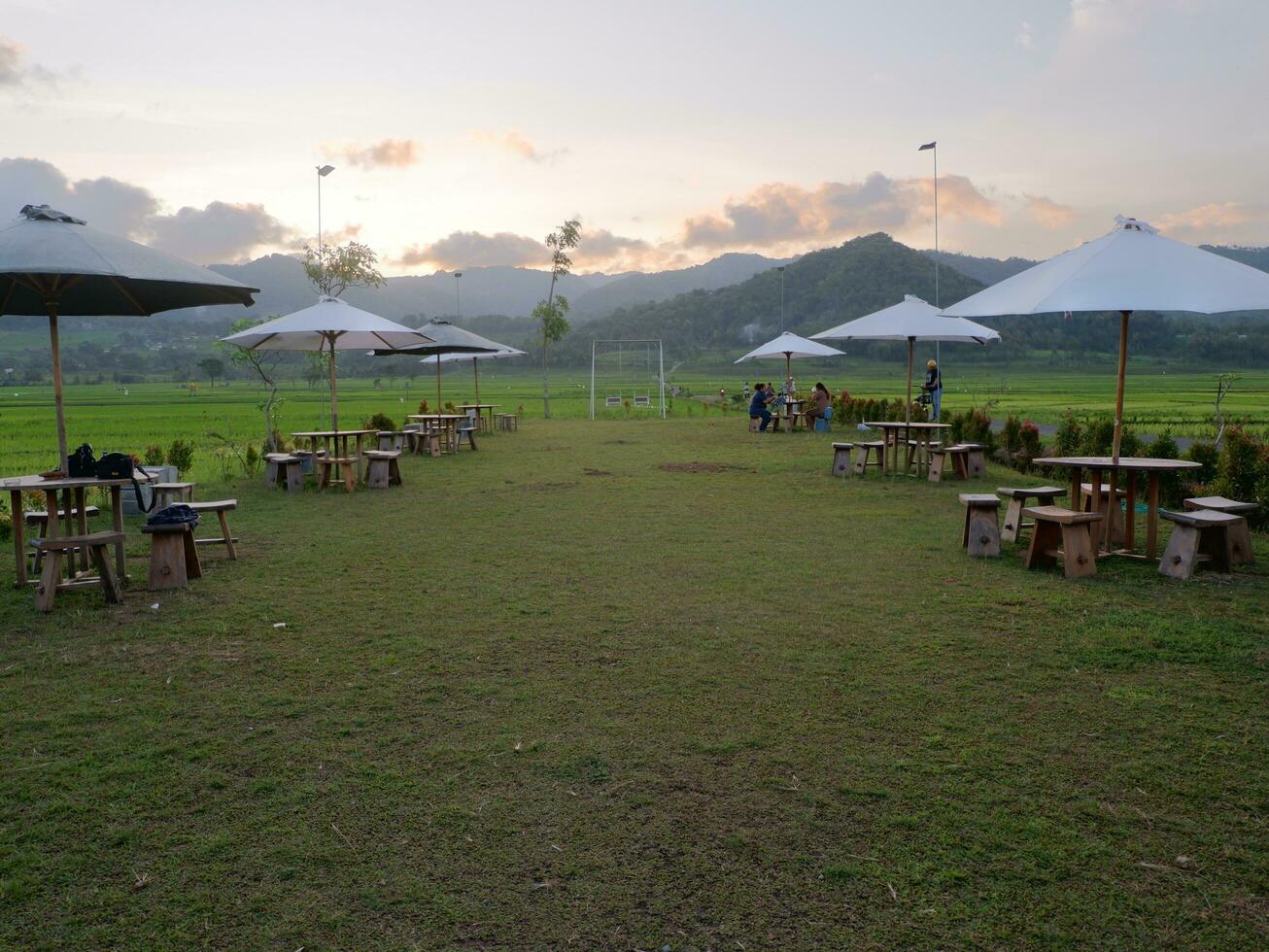 Yogyakarta, Indonesia - March 08th 2023 - Photo of a place to hang out in the park with beautiful natural views of rice fields in the afternoon.