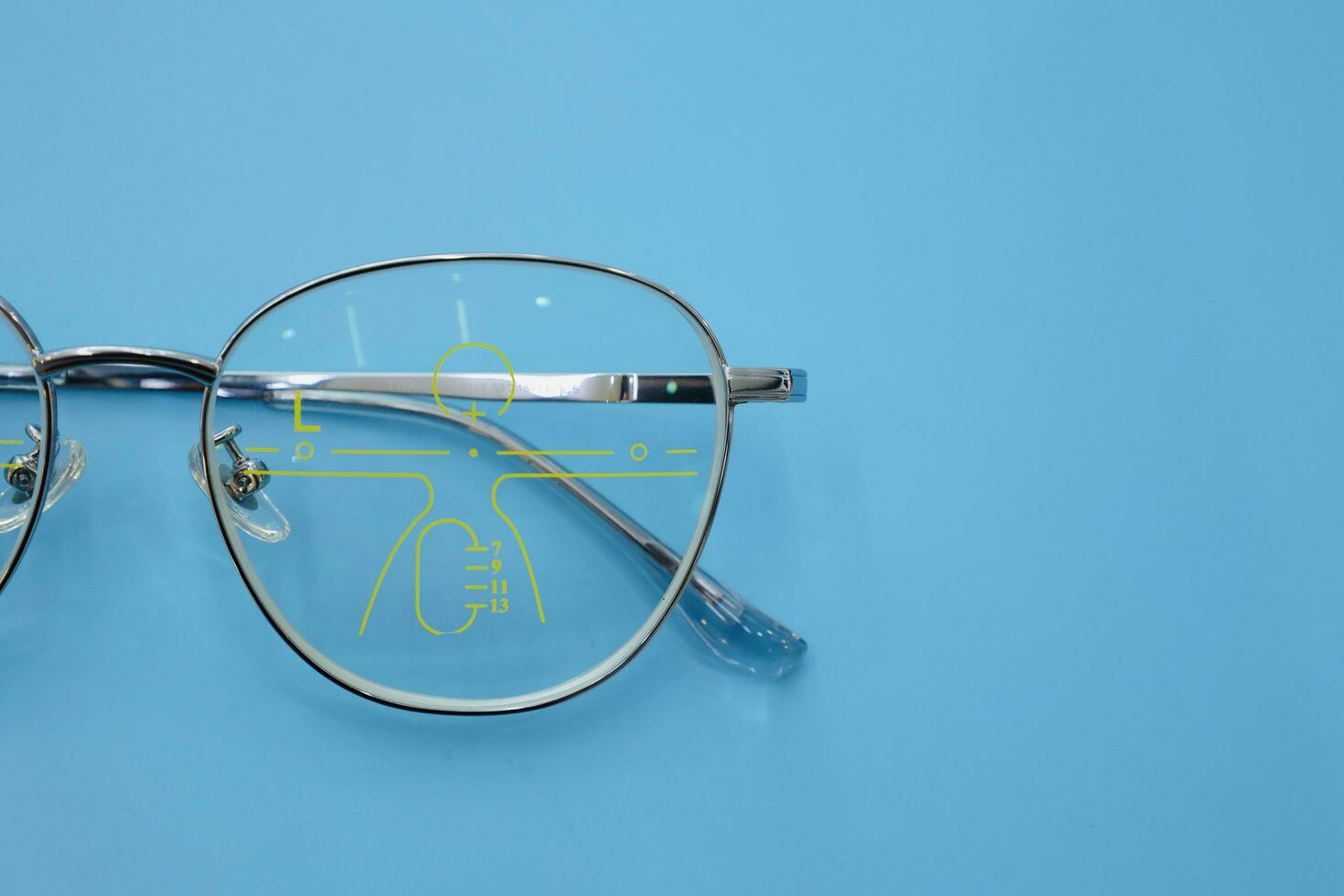 Close-up of glasses, eyeglass progressive lenses photo