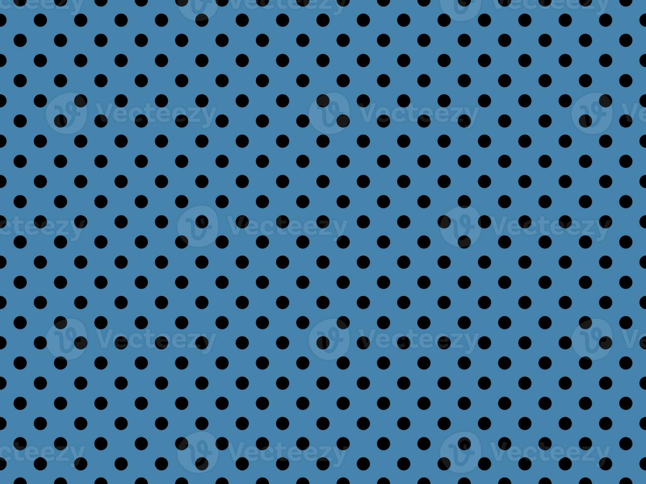 black polka dots over steel blue background photo