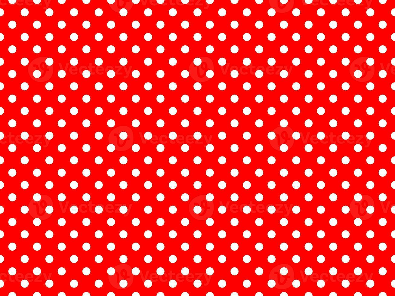 white polka dots over red background photo