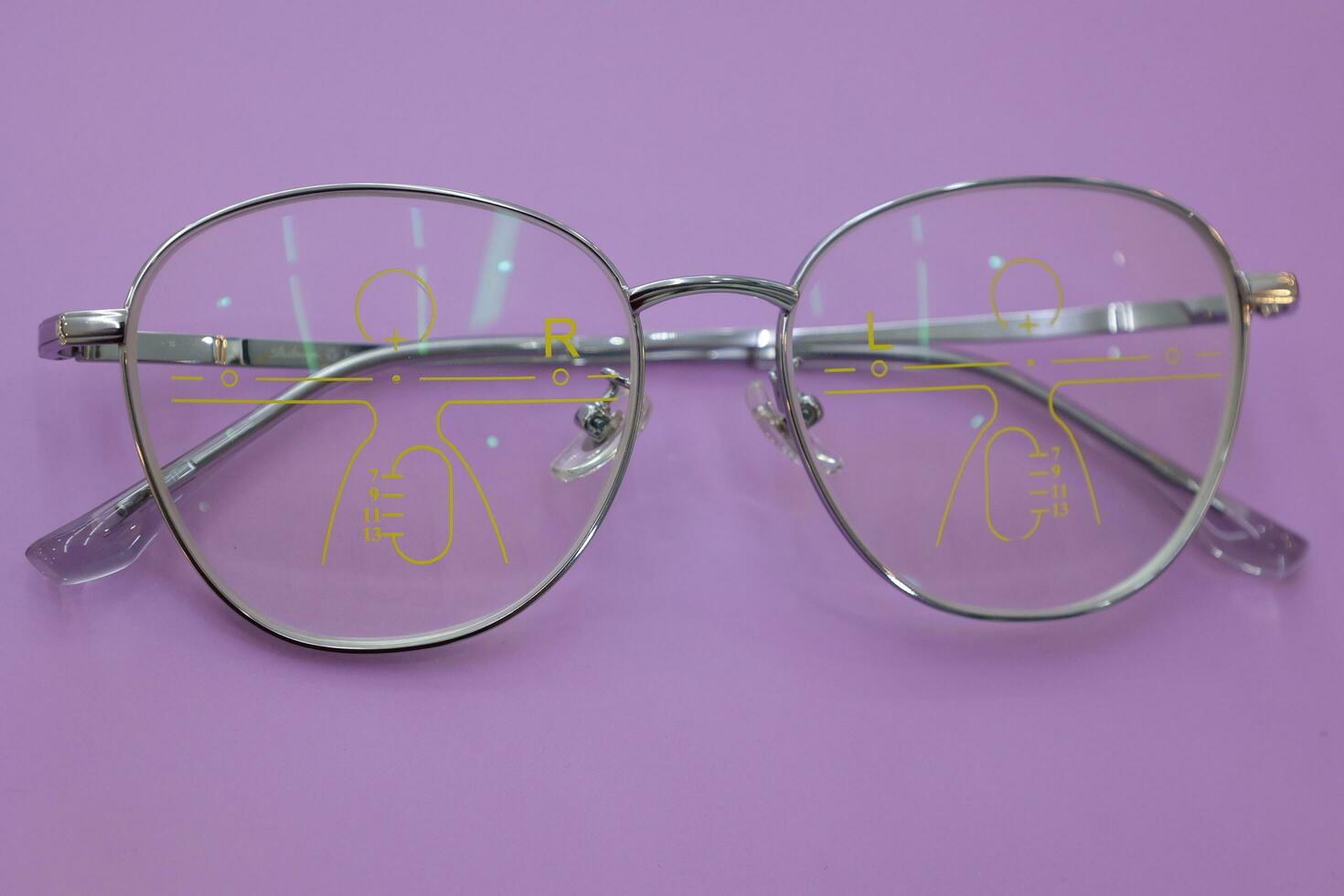 Close-up of glasses, eyeglass progressive lenses photo
