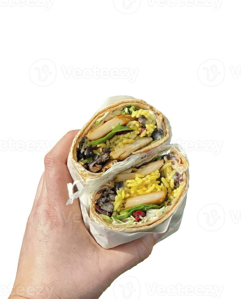 Chicken wrap in a hand closeup view white background photo