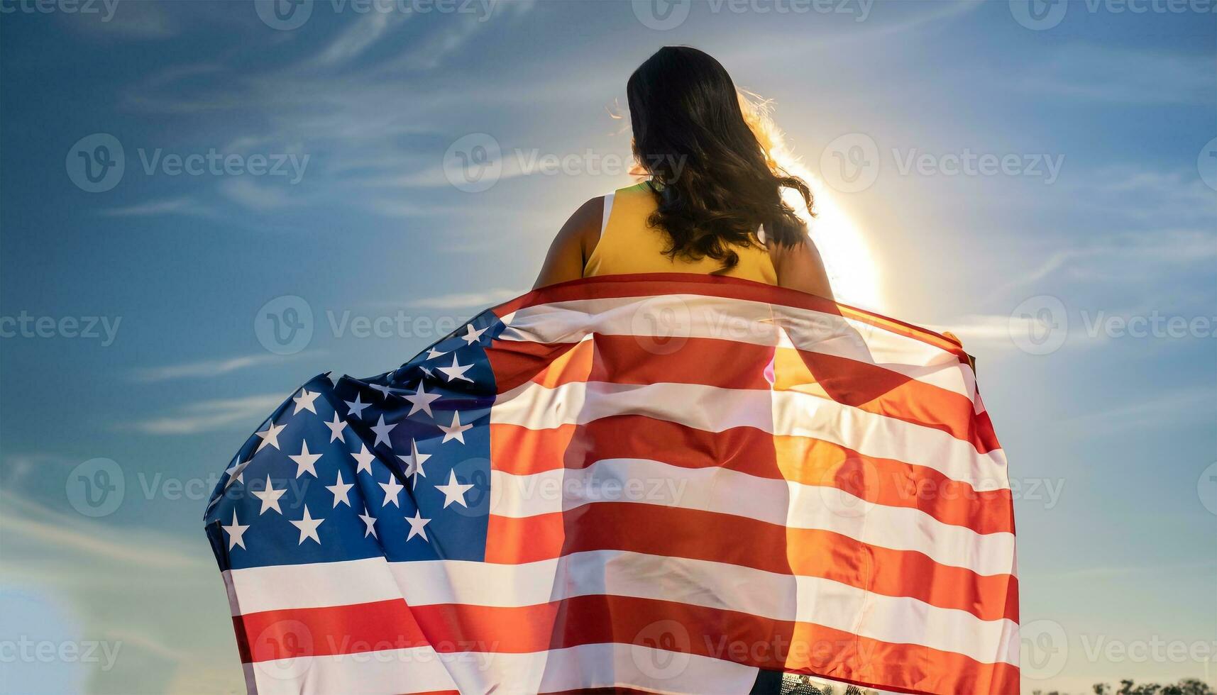 woman holding USA flag and looking at sunrice photo