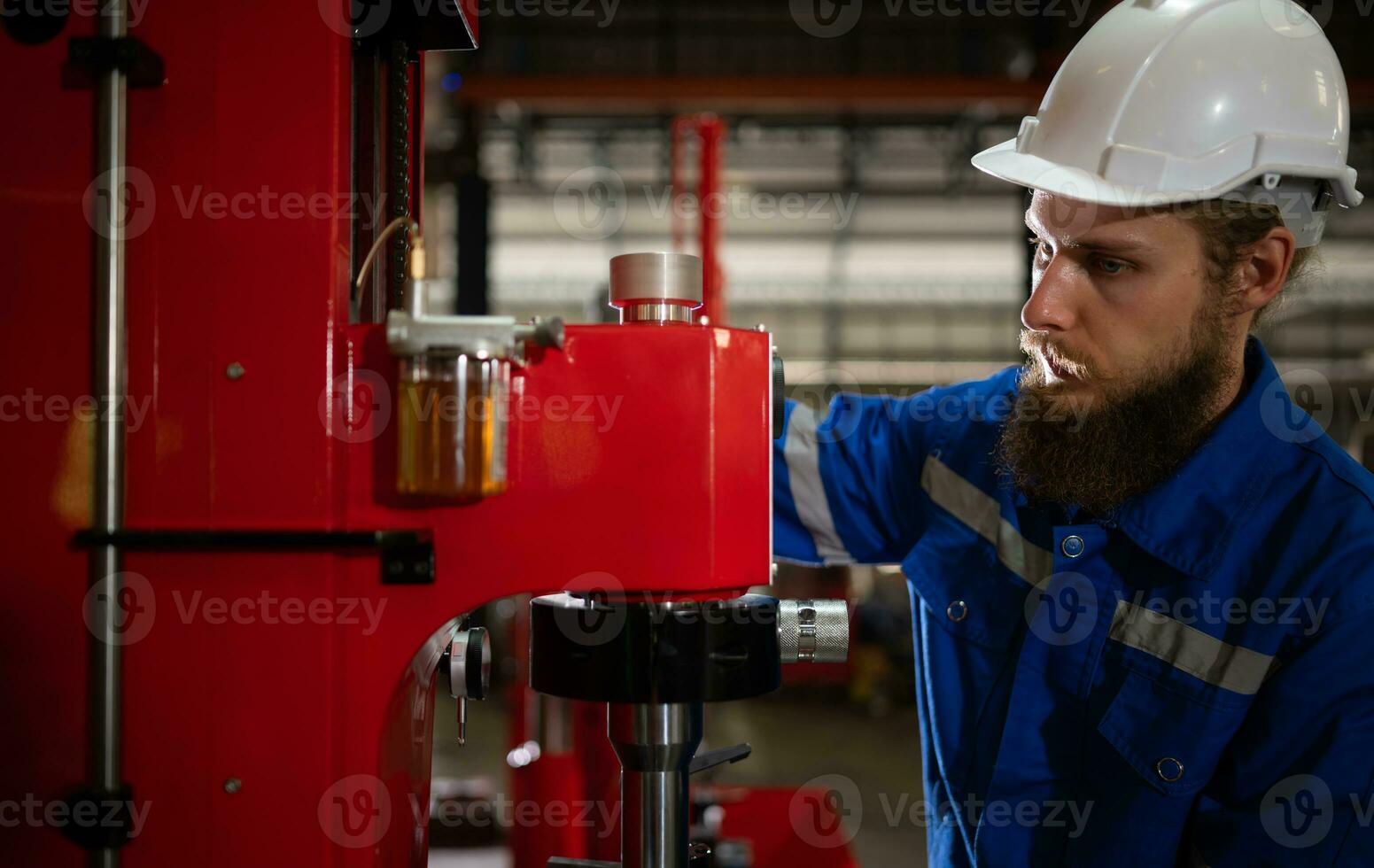 Mechanical engineers are checking the working condition of the new machine after completing the installation photo