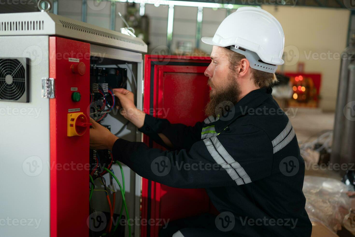 Electrical engineer with the mission of installing a robot arm electrical system photo