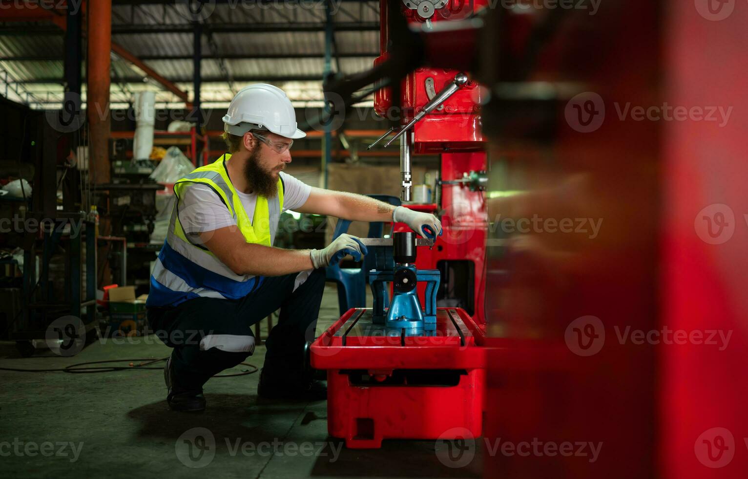Mechanical engineers are checking the working condition of the new machine after completing the installation photo