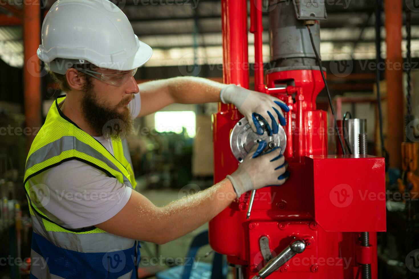 Mechanical engineers are checking the working condition of the new machine after completing the installation photo