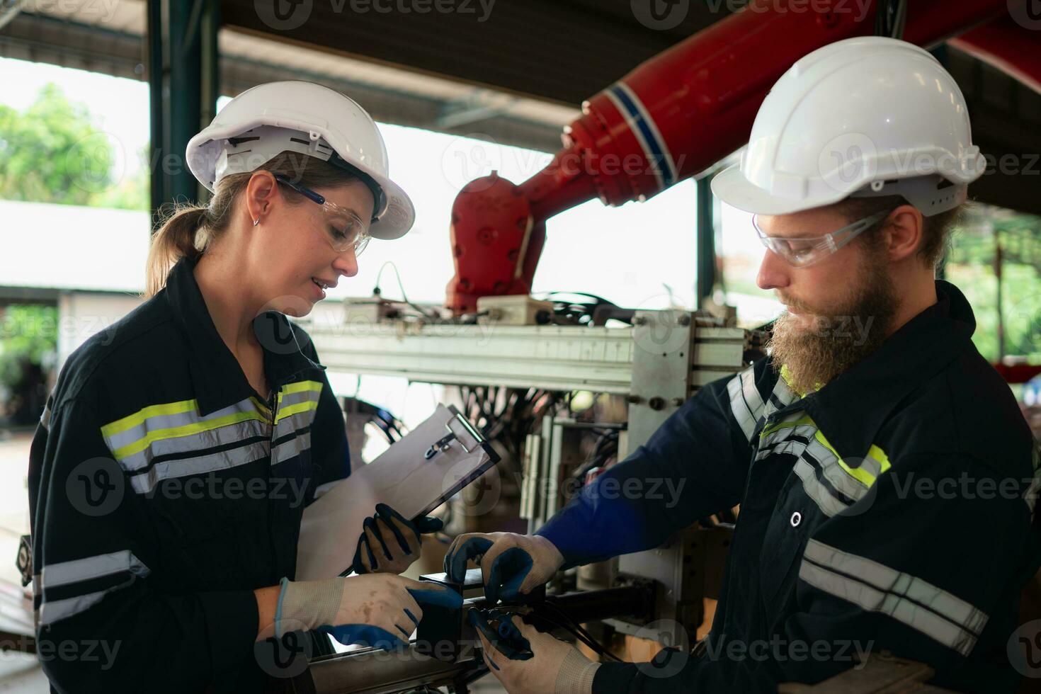 Electrical engineer with the mission of installing a robot arm electrical system photo