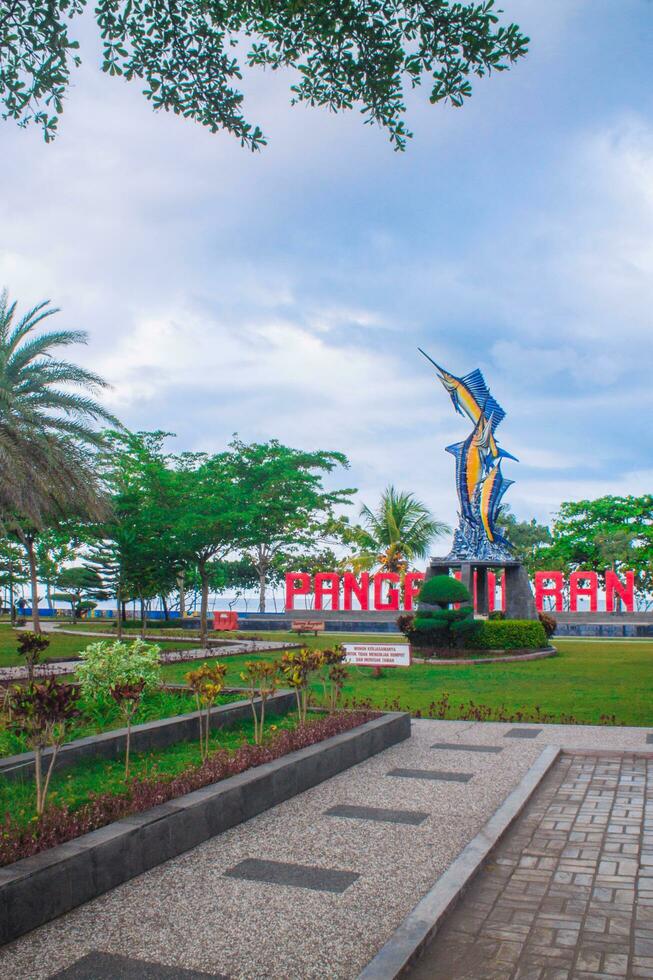 October 13, 2021, Pangandaran, West java, Indonesia - The marlin fish monument park on Pangandaran beach is provided for tourists to rest, take pictures and wait for the sunset photo