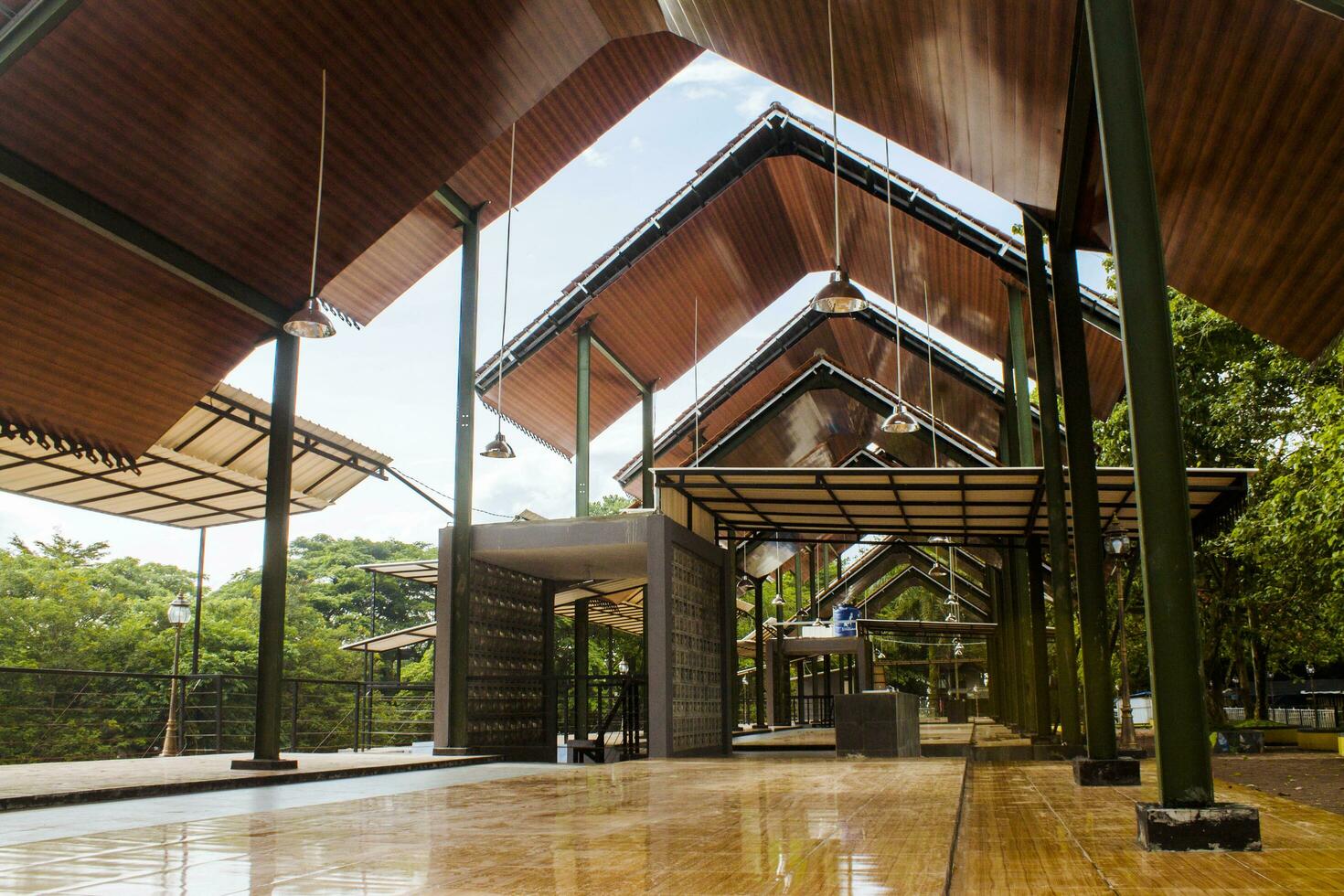 A house in a park where tourists sit, relax and rest at the destination of Lake Situ Gede, Tasikmalaya, West Java, Indonesia photo