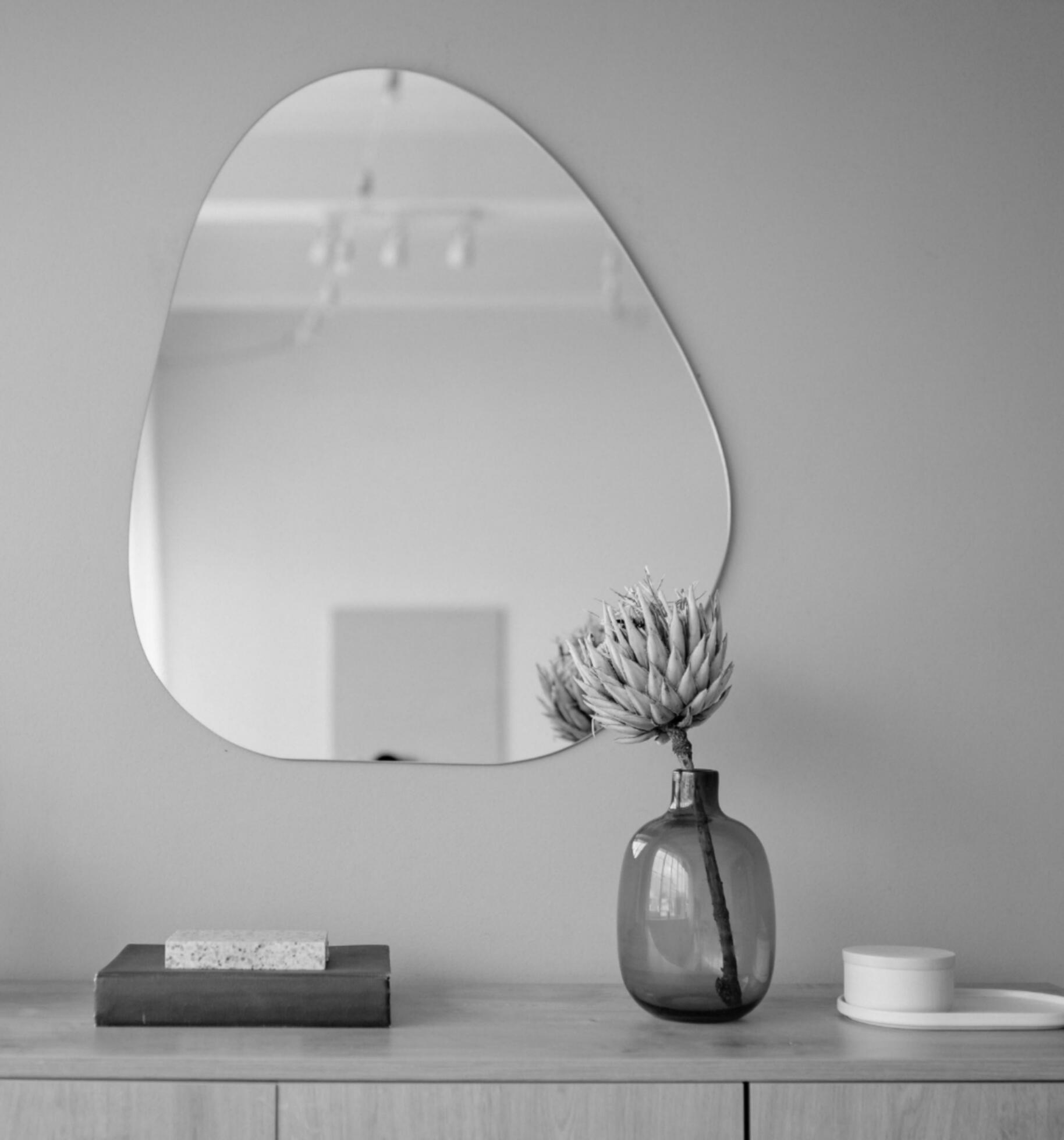 asymmetrical mirror home decor 25779844 Stock Photo at Vecteezy