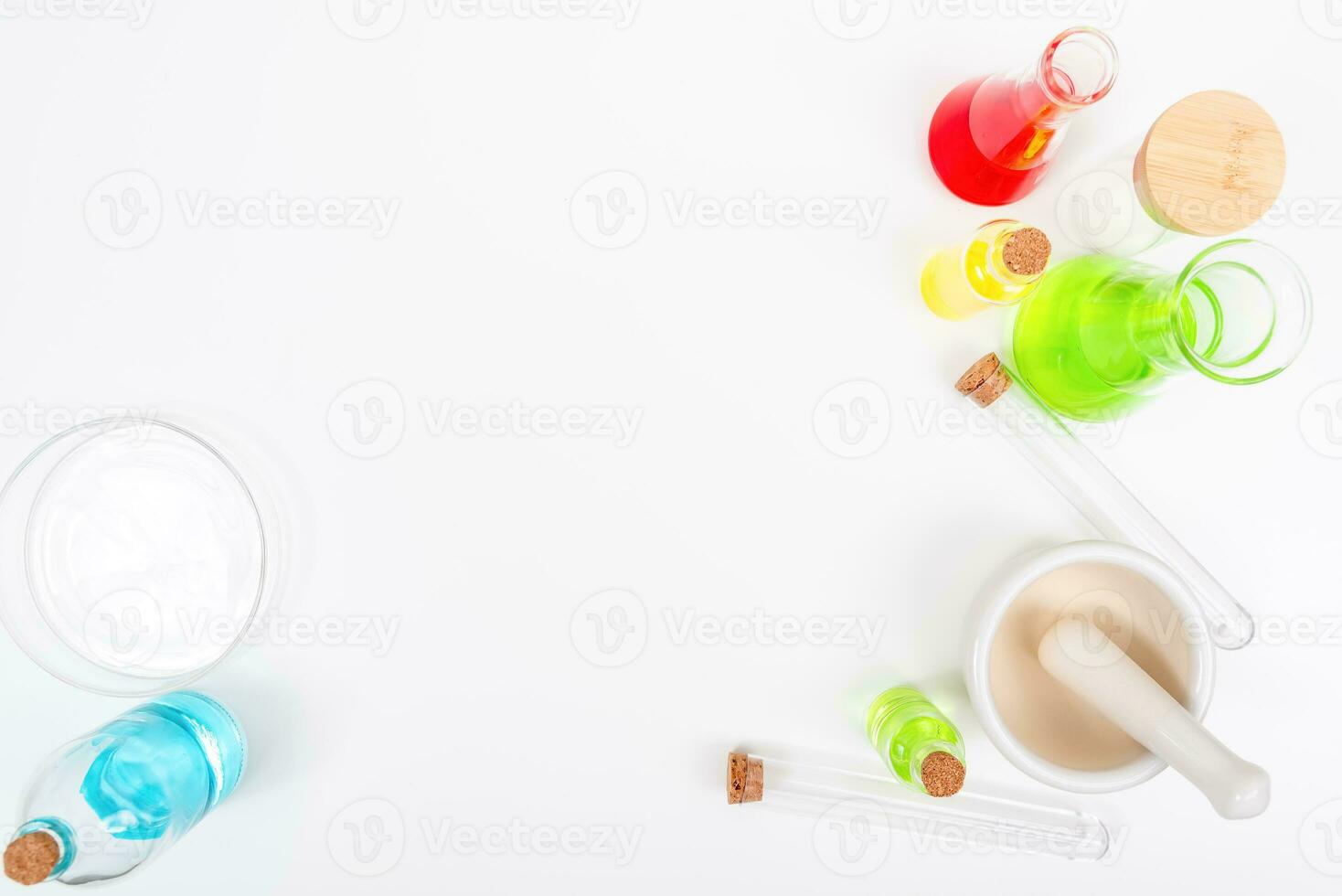 Top view science lab chemistry flask with beakers, flasks, and test tubes filled with colorful liquids photo
