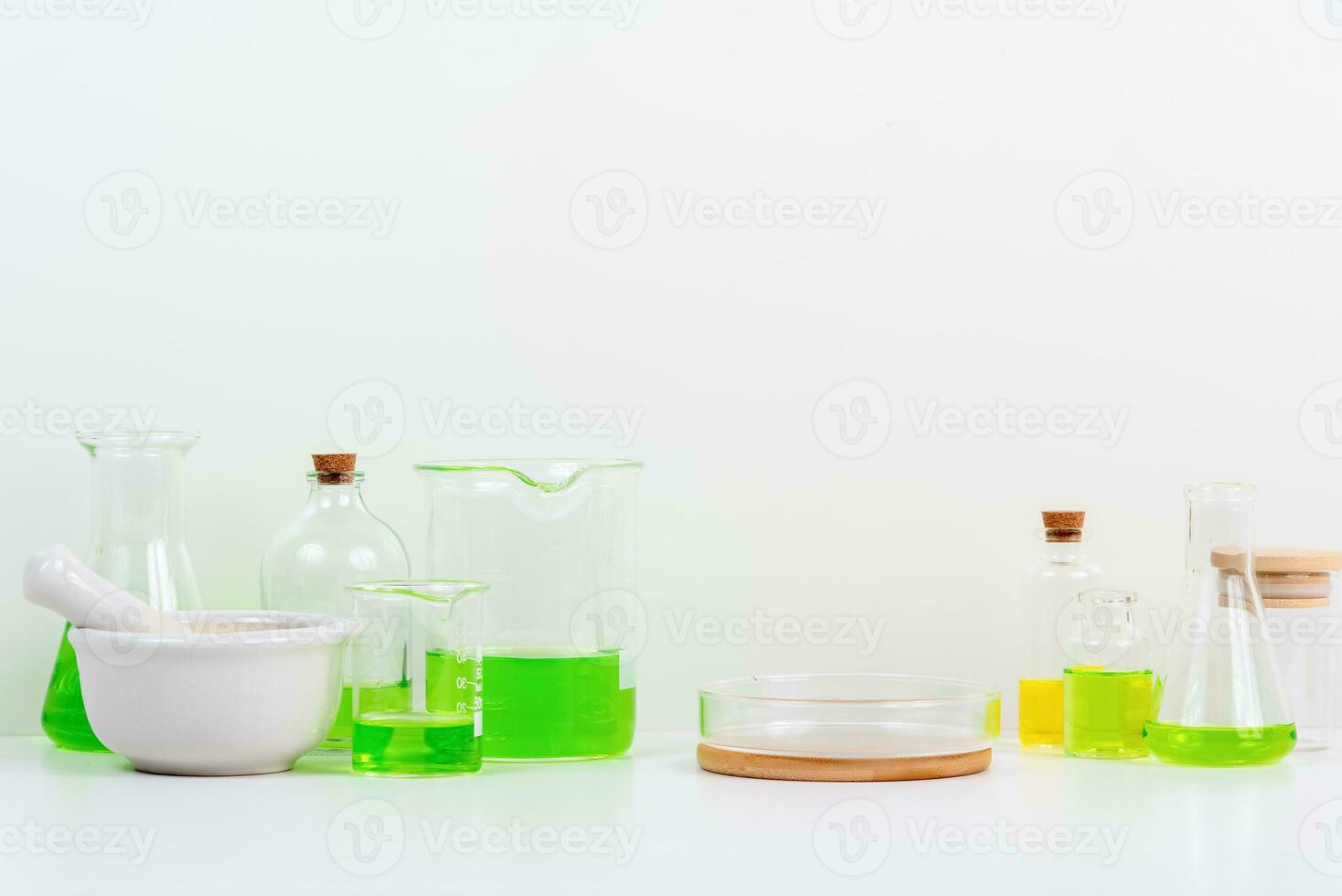 some test tube on the white table with beakers, flasks, and test tubes filled with colorful liquids photo