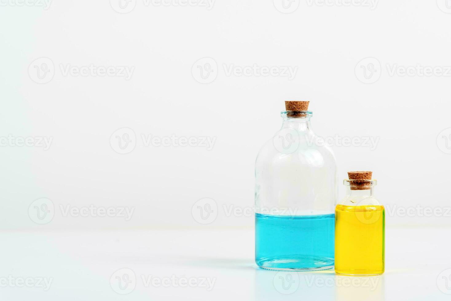 some test tube on the white table with beakers, flasks, and test tubes filled with colorful liquids photo