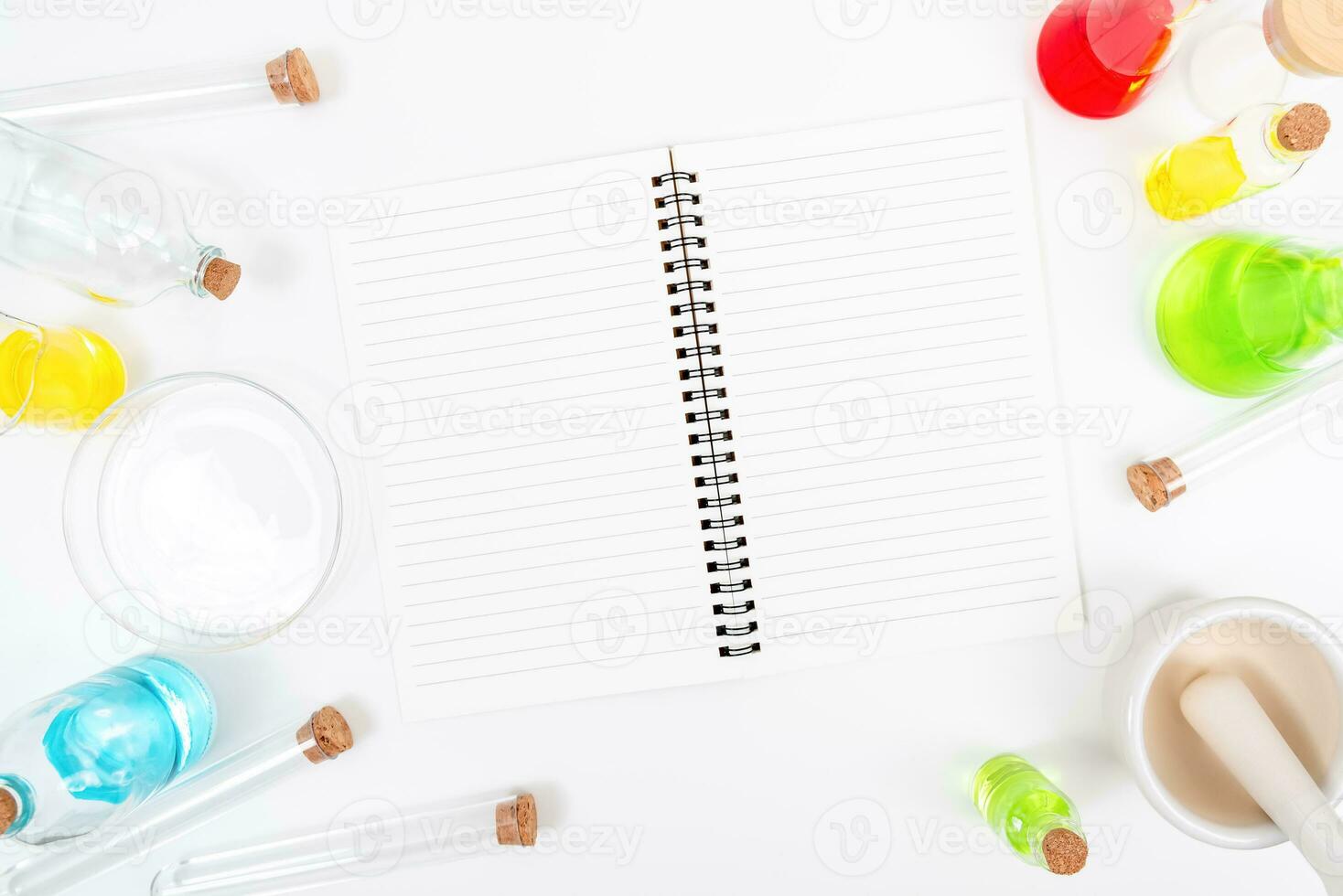 Top view science lab chemistry flask with beakers, flasks, and test tubes filled with colorful liquids photo