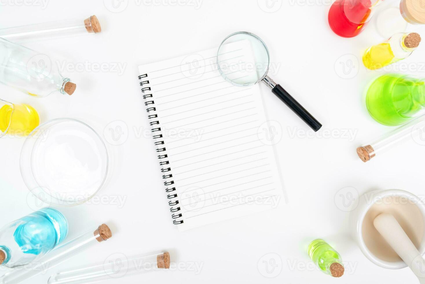 Top view science lab chemistry flask with beakers, flasks, and test tubes filled with colorful liquids photo
