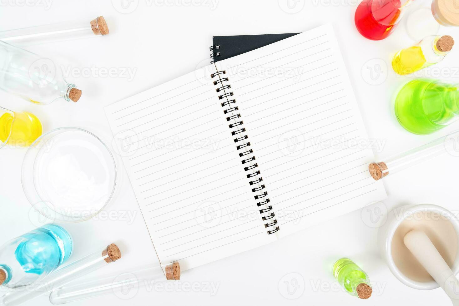 Top view science lab chemistry flask with beakers, flasks, and test tubes filled with colorful liquids photo