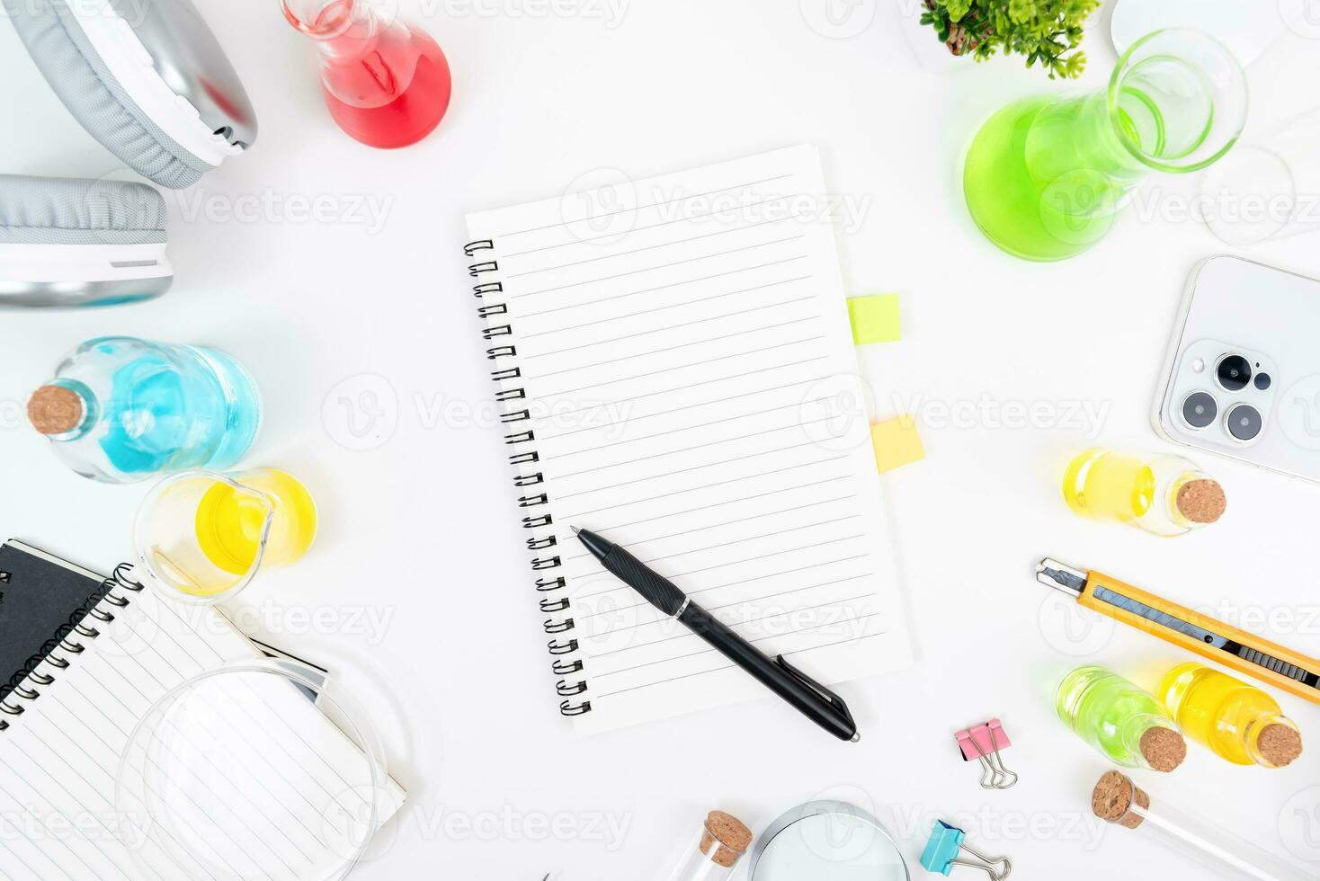 Top view science lab chemistry flask with beakers, flasks, and test tubes filled with colorful liquids photo