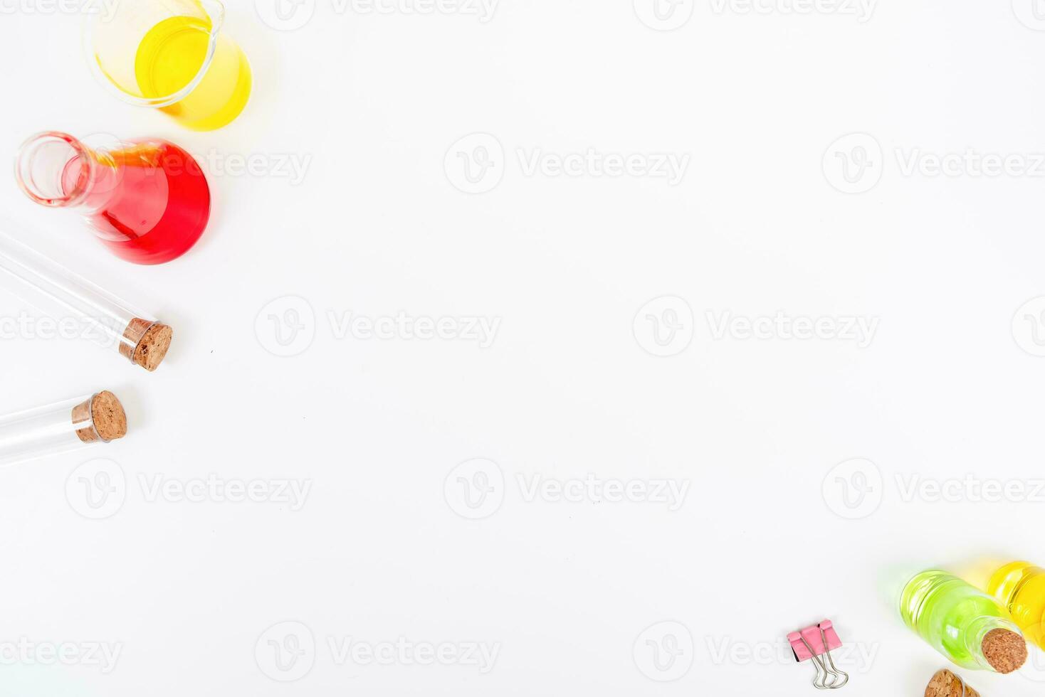 Top view science lab chemistry flask with beakers, flasks, and test tubes filled with colorful liquids photo