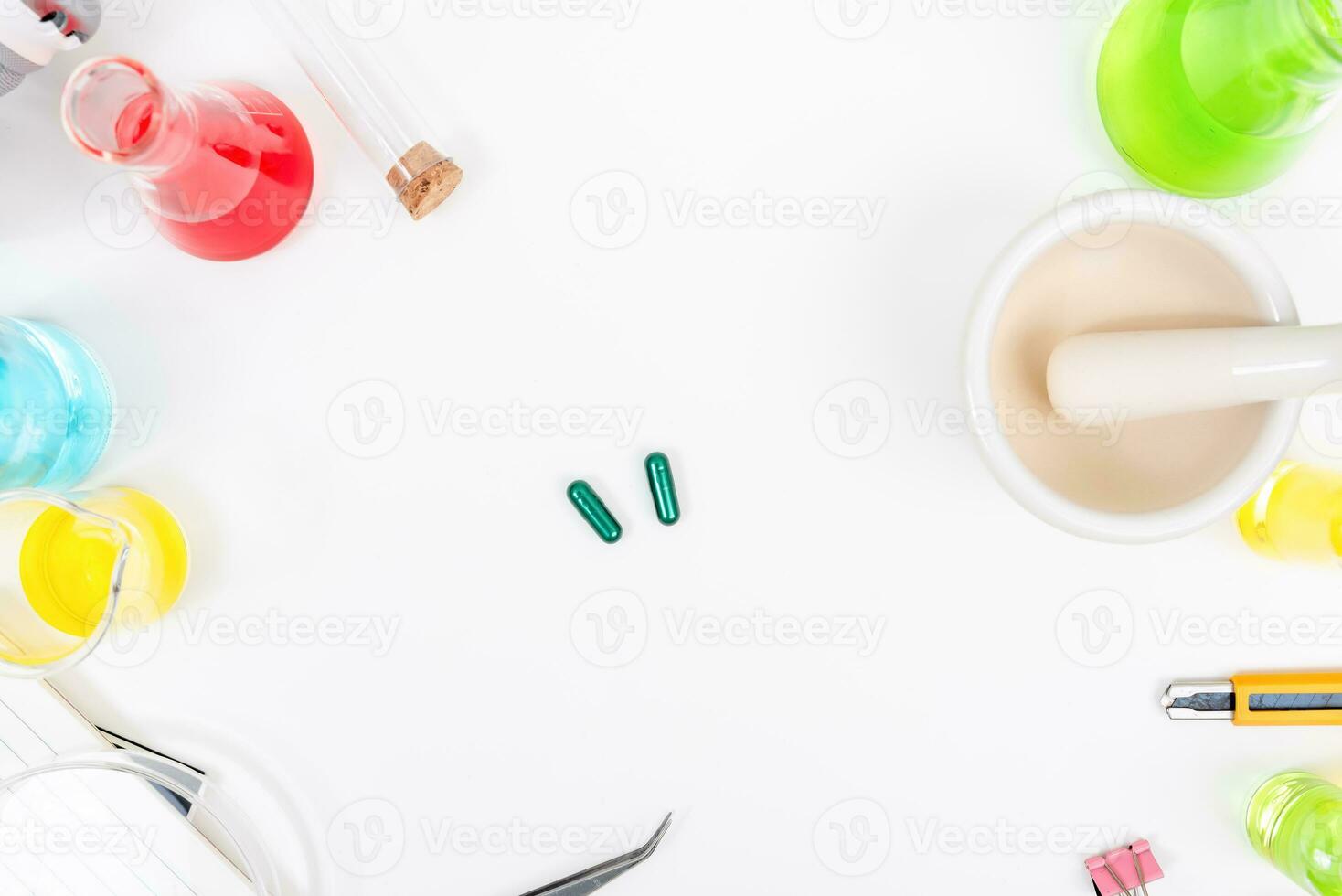 Top view science lab chemistry flask with beakers, flasks, and test tubes filled with colorful liquids photo