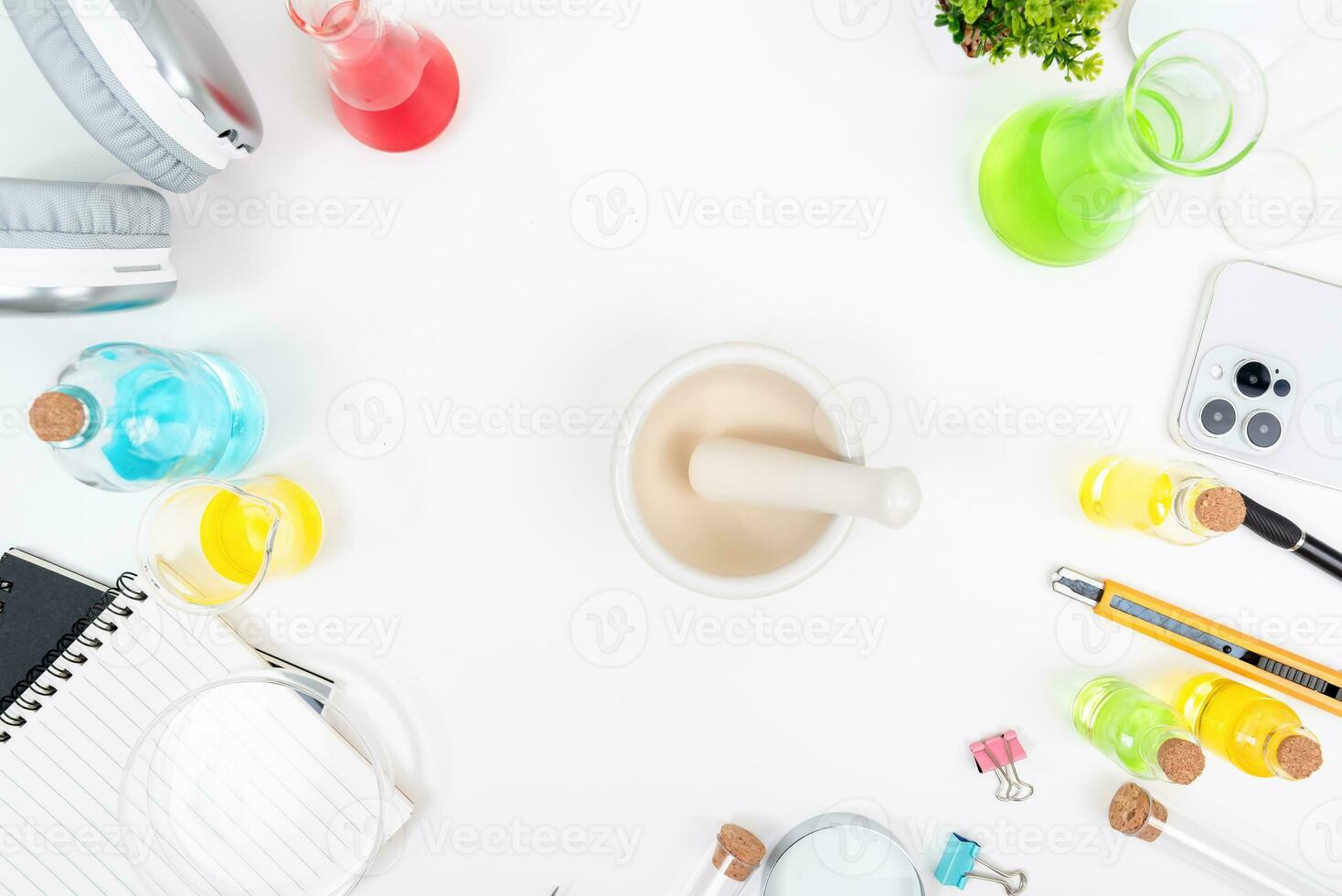 Top view science lab chemistry flask with beakers, flasks, and test tubes filled with colorful liquids photo