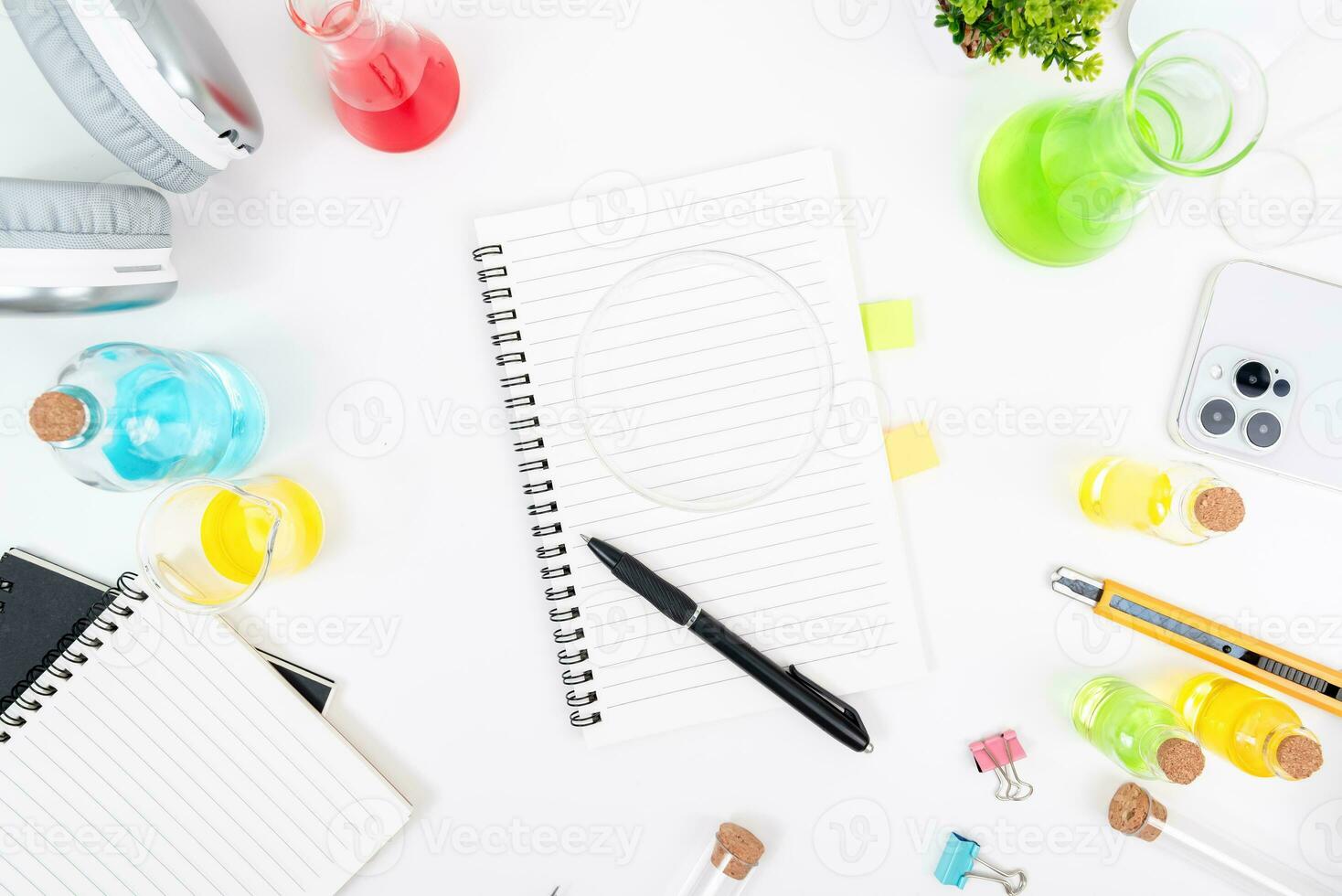 Top view science lab chemistry flask with beakers, flasks, and test tubes filled with colorful liquids photo