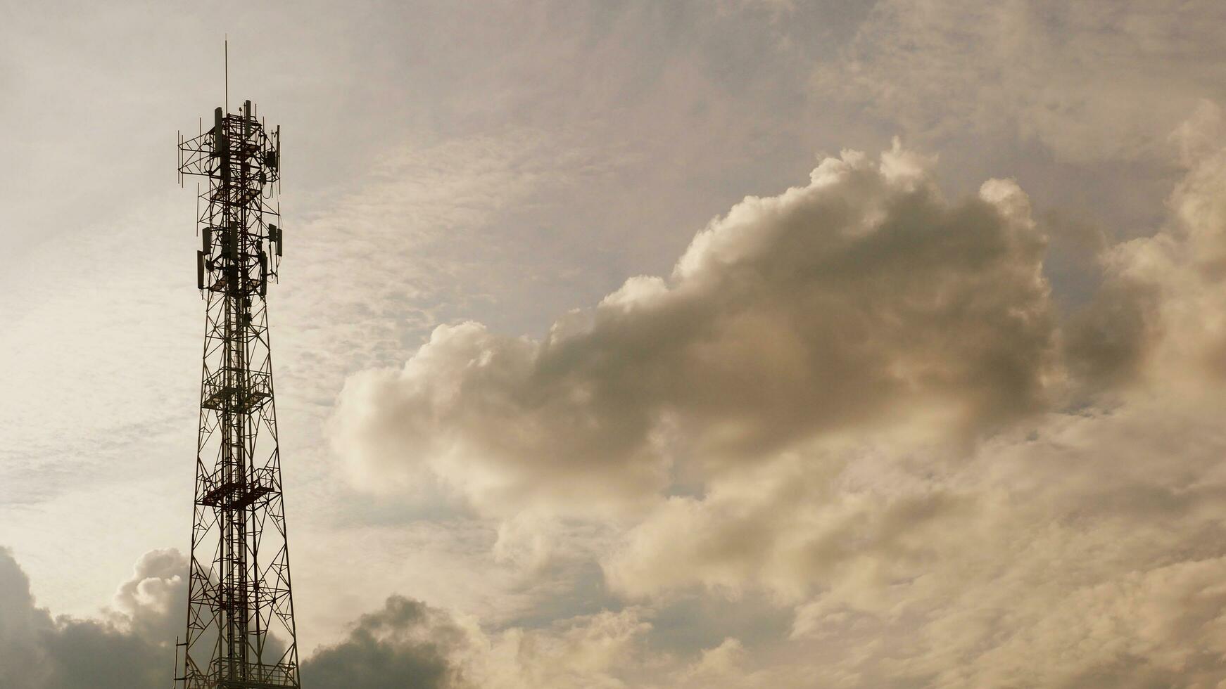 Telephone towers used to broadcast signals at dusk. photo