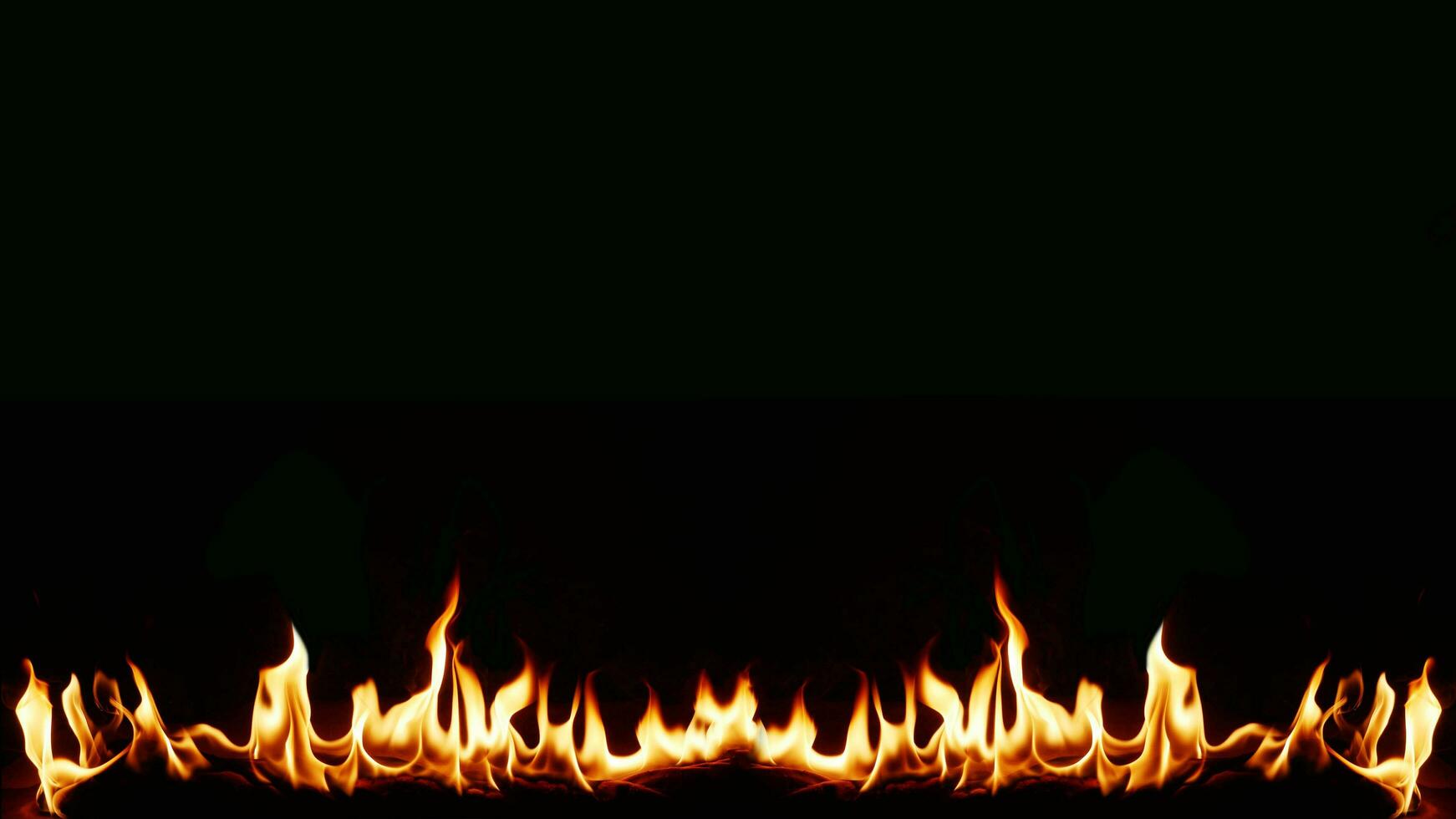 A beautiful flame shaped as imagined. like from hell, showing a dangerous and fiery fervor, black background photo