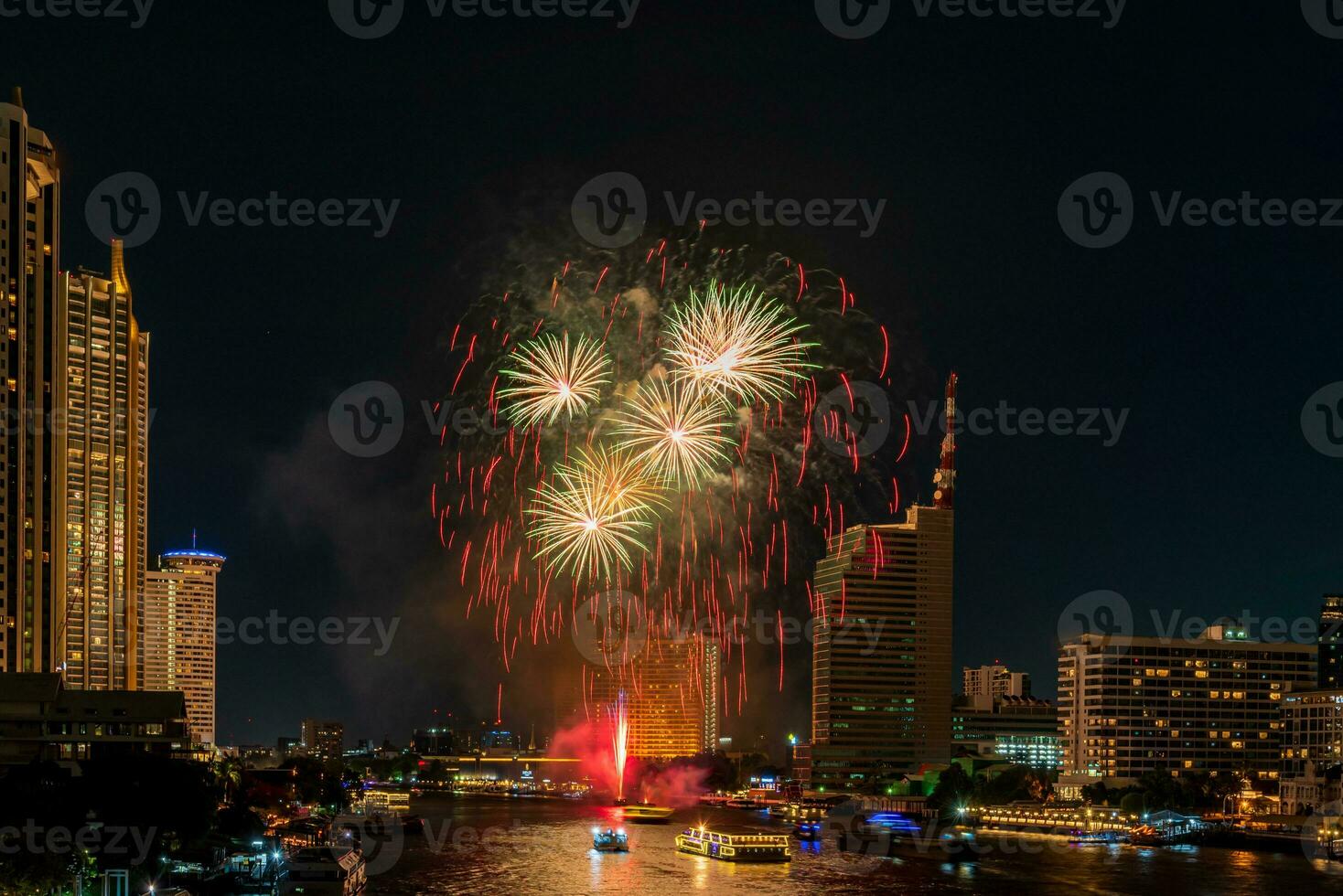 fireworks on the river in the dark sky photo