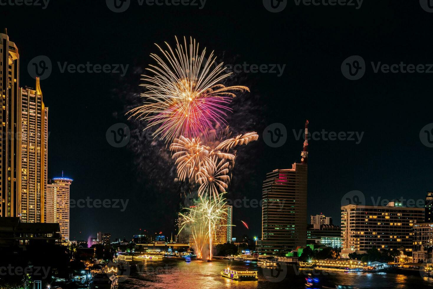 fireworks on the river in the dark sky photo