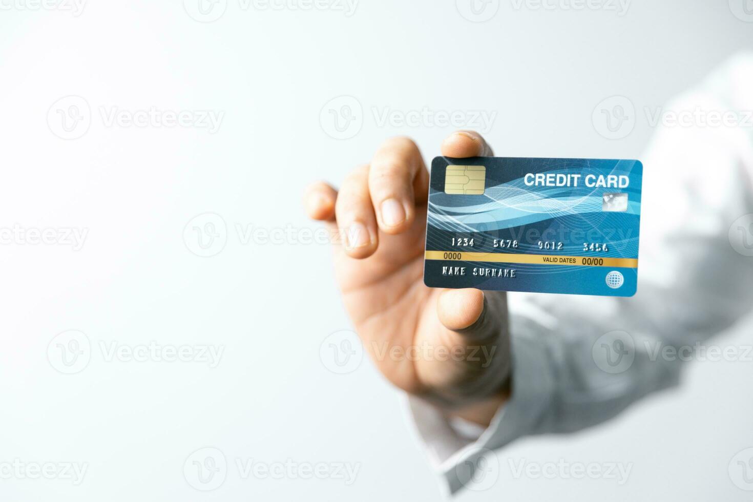 Focused businesswoman utilizing a credit card to manage transactions efficiently at a contemporary desk. Professional working highlighting modern finance, online shopping, digital technology. photo