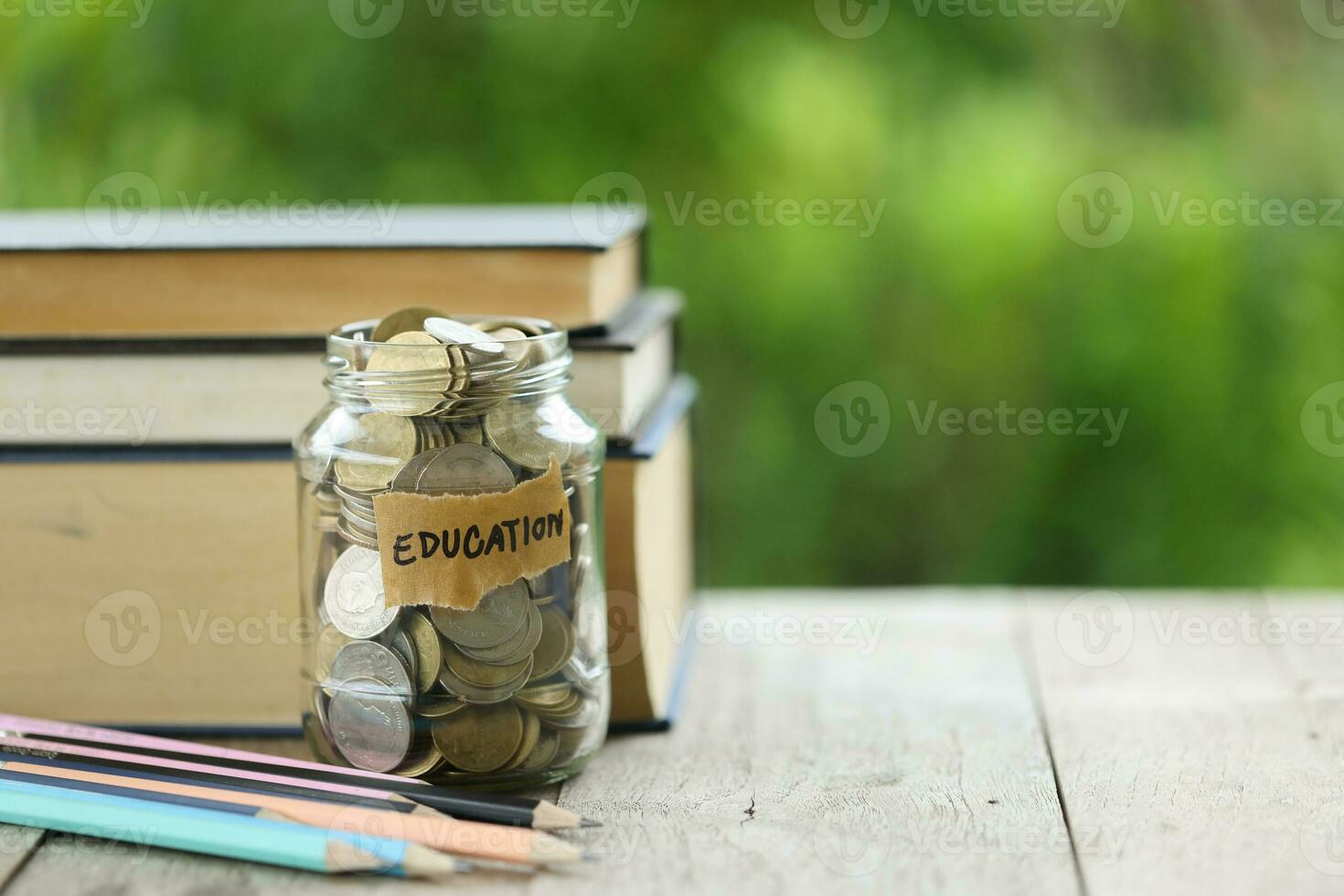 Knowledge and Success Graduation Cap on Books Against a Beautiful Nature Background. Achievement Unlocked Graduation Cap and Books Symbolize Education Savings and Academic Growth. photo