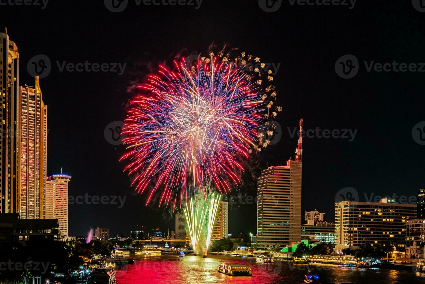 fireworks on the river in the dark sky photo